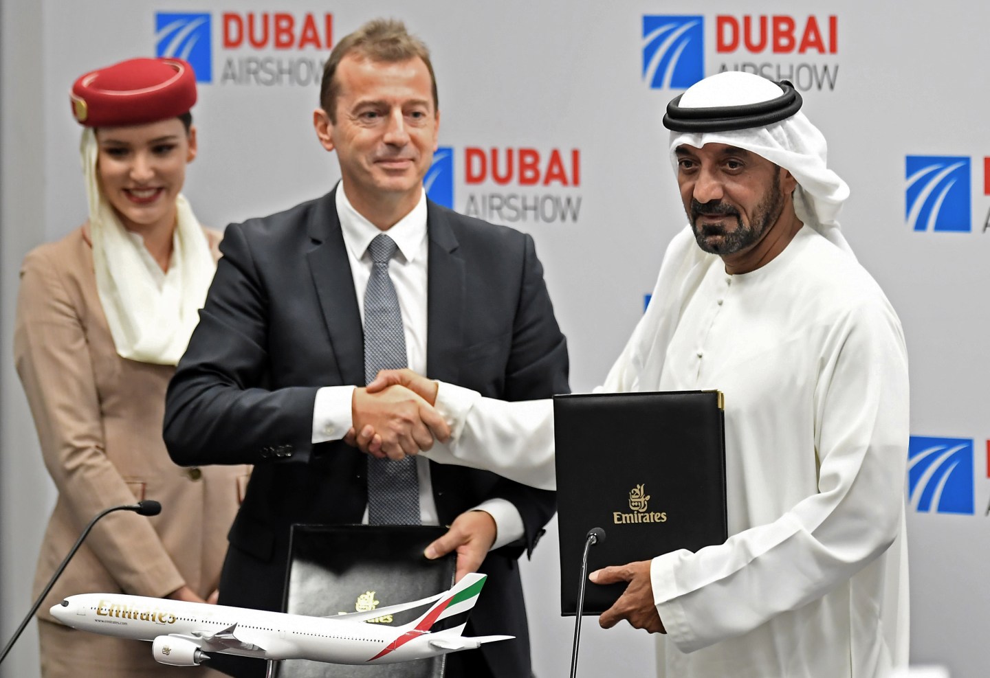 Ahmed bin Saeed Al Maktoum (R), CEO and chairman of the Emirates Group, and Guillaume Faury, Airbus CEO, pose for a picture after the signing of an agreement during the Dubai Airshow on November 18, 2019. - Emirates Airline said it will buy 50 Airbus 350-900 aircraft in a deal worth $16 billion, with delivery to begin from May 2023. (Photo by KARIM SAHIB / AFP) (Photo by KARIM SAHIB/AFP via Getty Images)