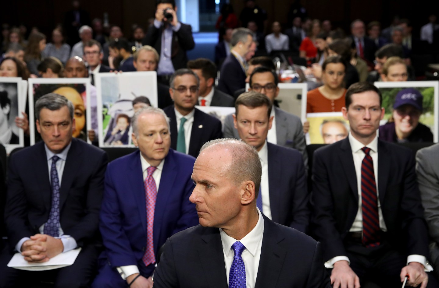 Dennis Muilenburg, president and CEO of the Boeing Company, sits at the witness table in front of family members of those who died aboard Ethiopian Airlines Flight 302 while waiting for the start of hearing held by the Senate Commerce Committee October 29, 2019 in Washington, DC.