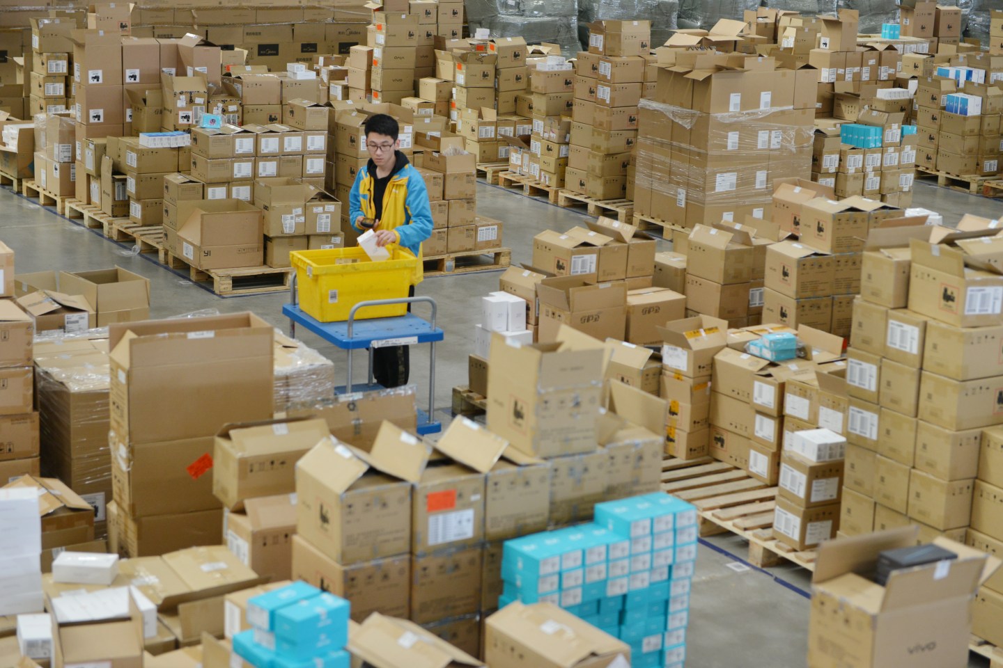 NANJING, CHINA - OCTOBER 30: A staff member of Suning Yuhua Logistics Center sorts parcels to prepare for the upcoming 2019 Double 11 Global Shopping Festival, also known as Singles' Day, on October 30, 2019 in Nanjing, Jiangsu Province of China. (Photo by Fang Dongxu/VCG via Getty Images)