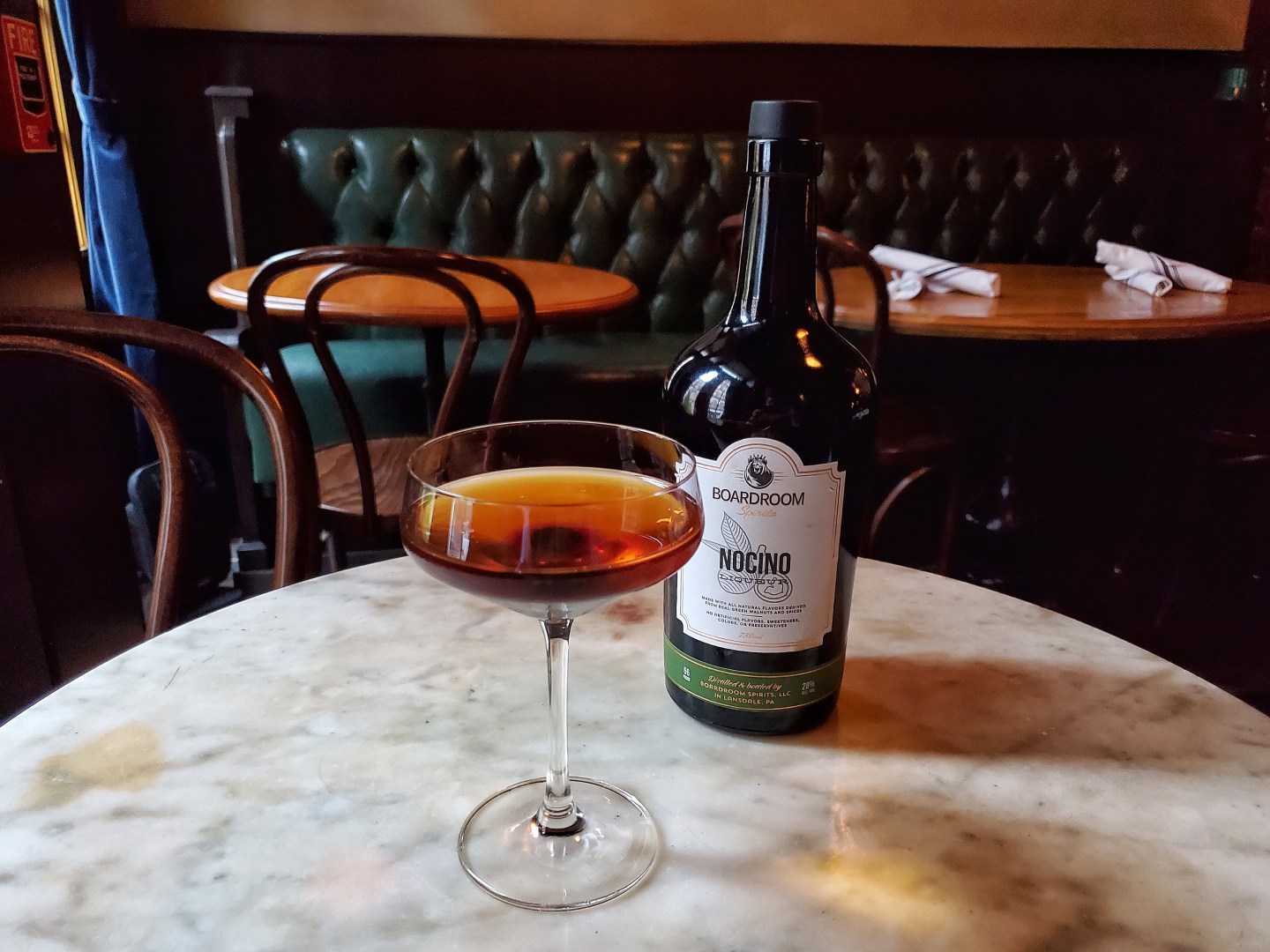 A black Manhattan made with Boardroom Spirits Nocino.