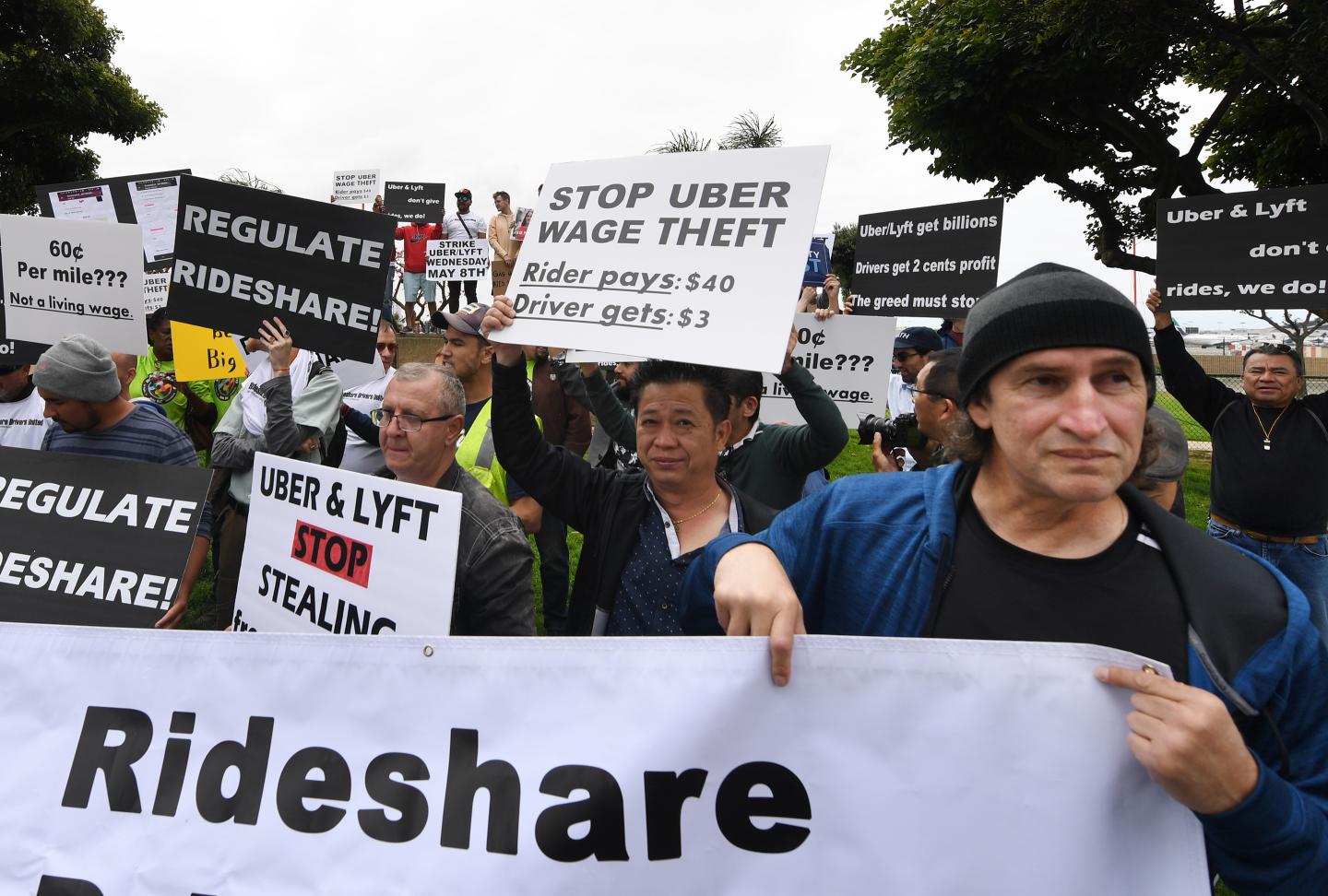 Uber and Lyft stage a strike and protest at the LAX