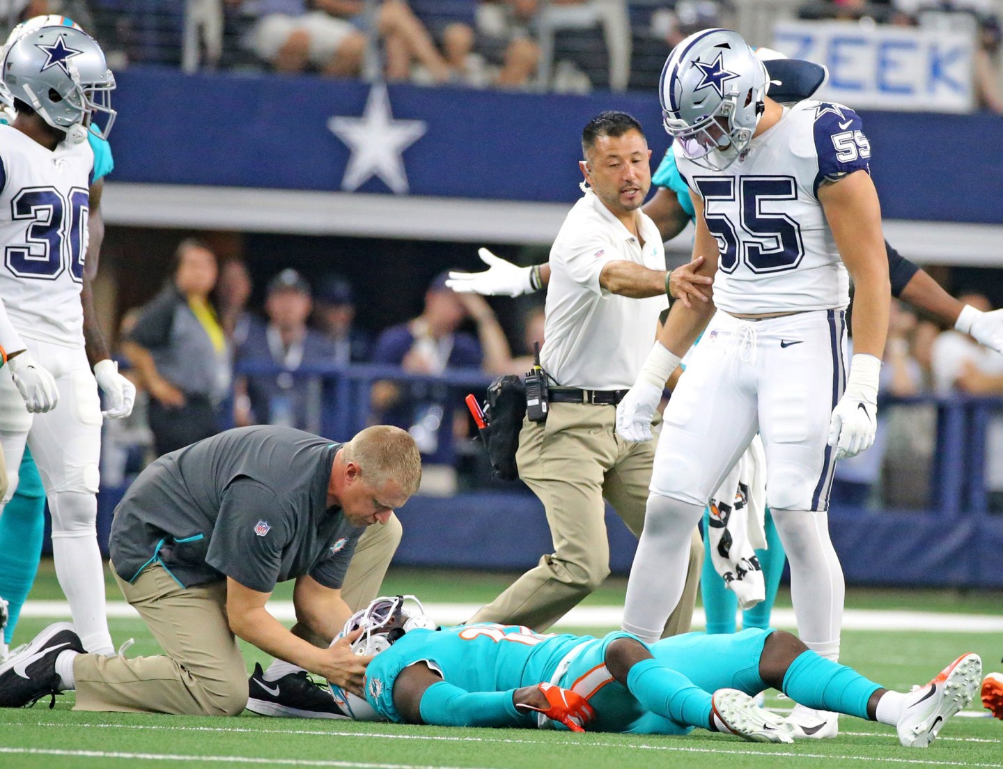 Miami Dolphins wide receiver Allen Hurns is attended to by medical staff after a collision in the first quarter against the Dallas Cowboys on Sunday, Sept. 22, 2019 at AT&T Stadium in Arlington, Texas. (Charles Trainor Jr./Miami Herald/Tribune News Service via Getty Images)