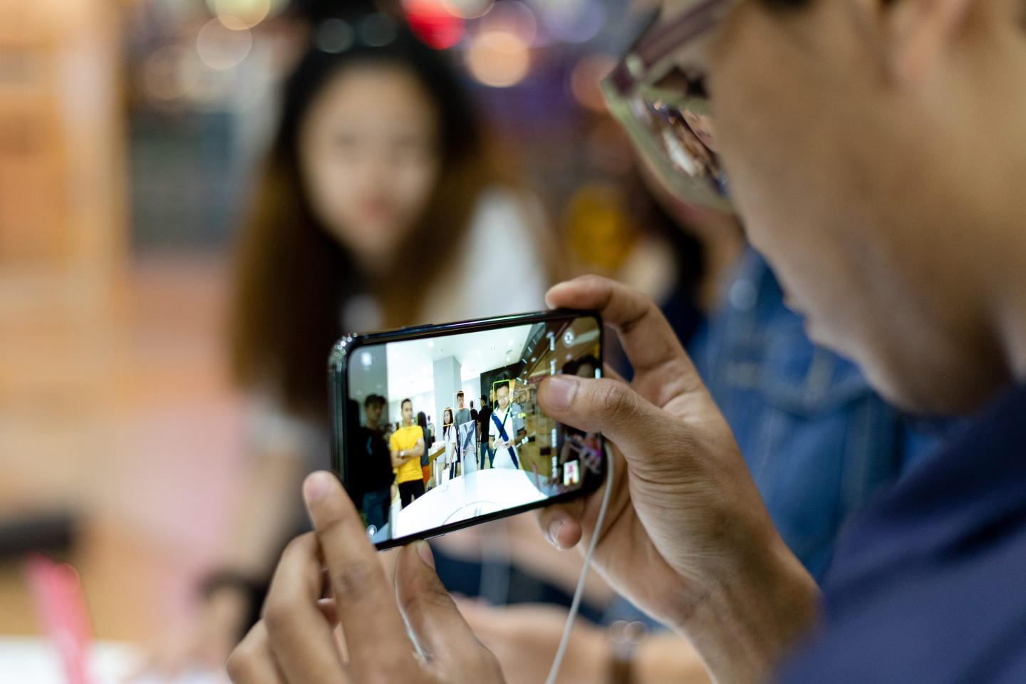 A customer takes a photograph with an iPhone 11 Pro at Apple store during a product launch event in Kuala Lumpur, Malaysia on Friday, September 27, 2019. Apple's new iPhones with camera enhancements and improved battery life go on sale today.  (Photo by Chris Jung/NurPhoto via Getty Images)