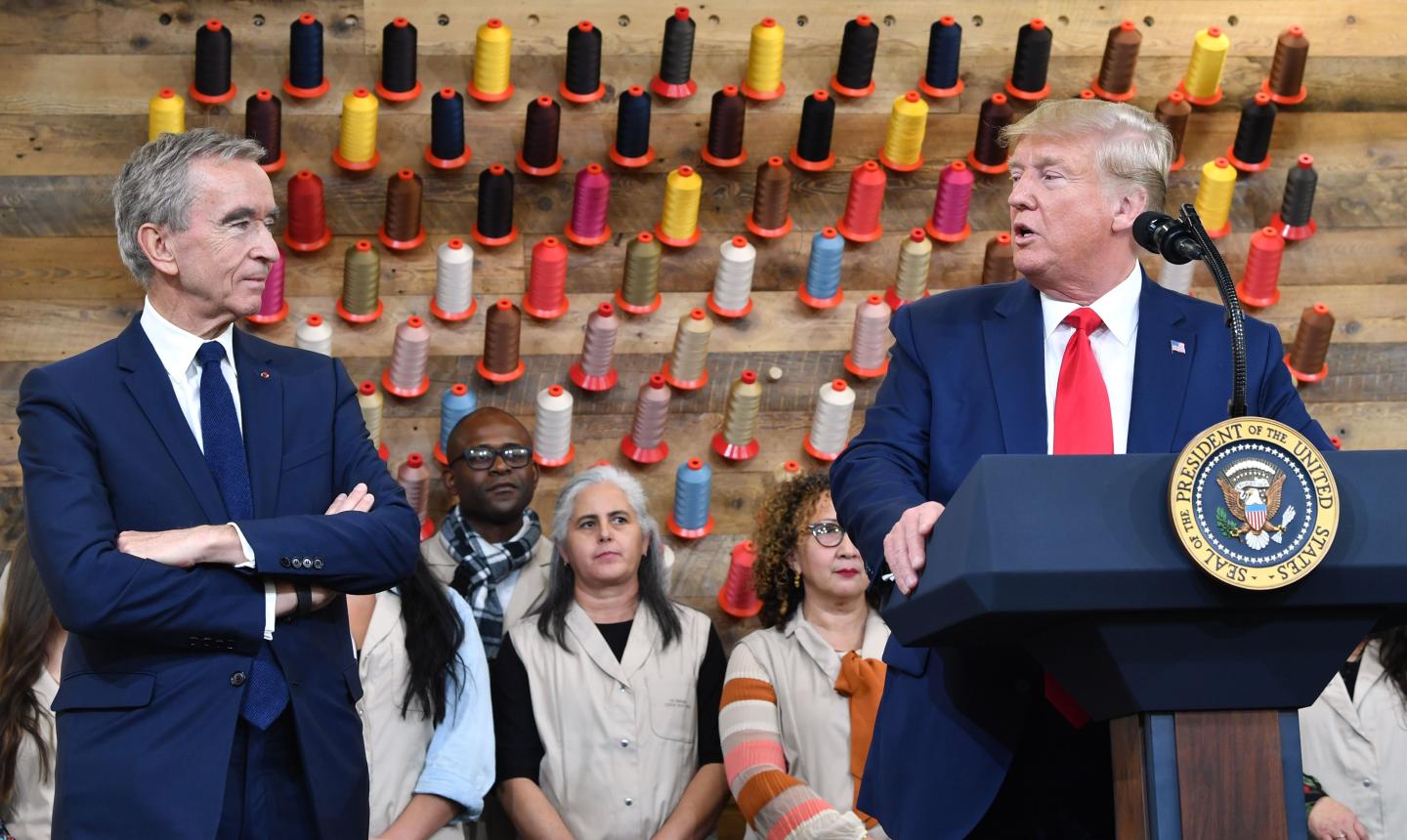 US President Donald Trump (R), flanked by Chief Executive of LVMH (Louis Vuitton Moet Hennessy) Bernard Arnault, speaks during a visit to the new Louis Vuitton factory in Alvarado (40 miles south of Fort Worth), Johnson County, Texas on October 17, 2019. - A workshop of the French brand Louis Vuitton will be inaugurated in Texas by Donald Trump, in the presence of Bernard Arnault, CEO of LVMH, who had indicated to the American President in 2017 that he was ready to invest more in the United States. (Photo by Nicholas Kamm / AFP) (Photo by NICHOLAS KAMM/AFP via Getty Images)