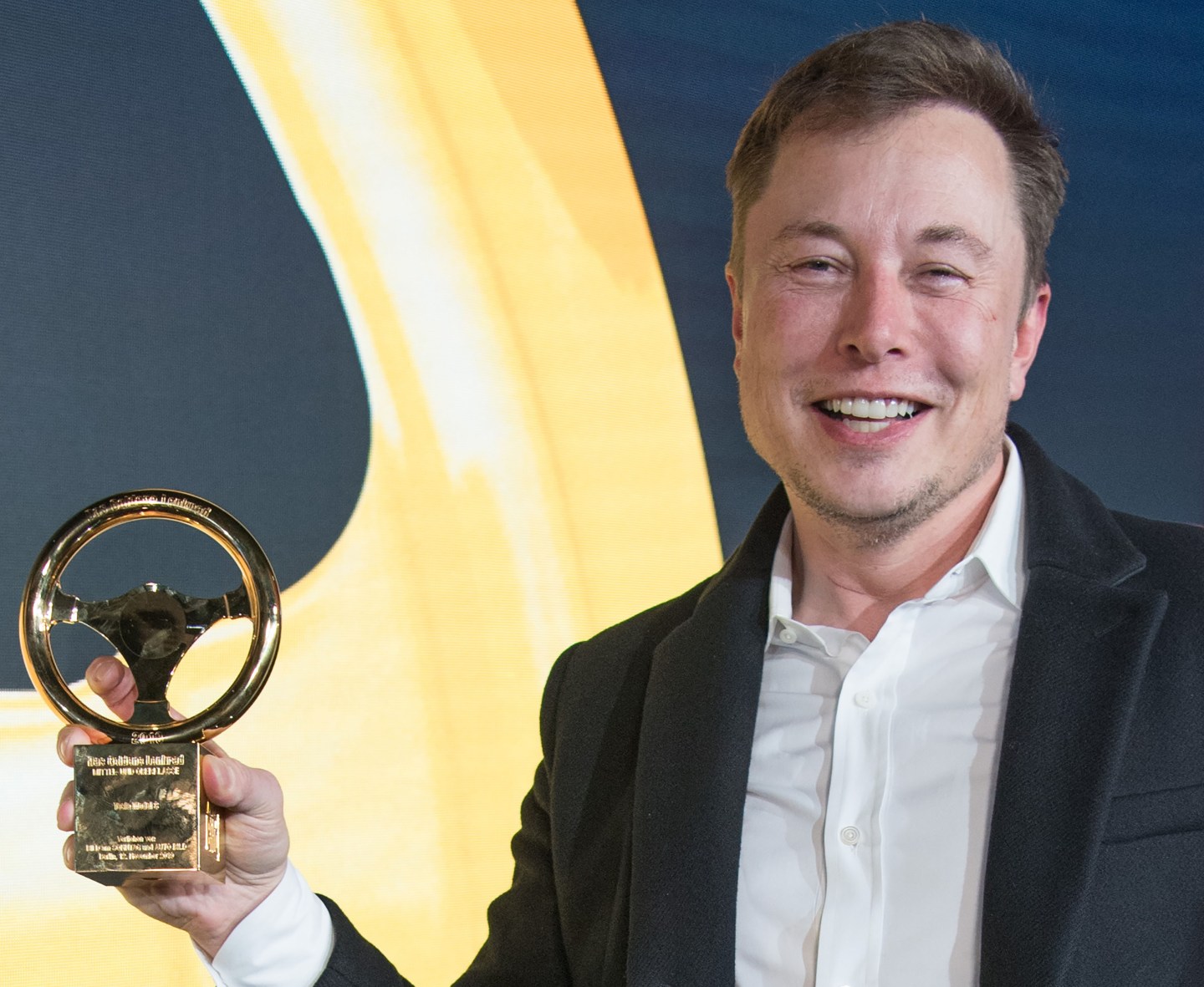 Elon Musk, CEO of Tesla and SpaceX, poses with his award during the 43rd "Goldenes Lenkrad" (Golden Steering Wheel) awards on November 12, 2019 in Berlin. (Photo by Jörg Carstensen / dpa / AFP) / Germany OUT (Photo by JORG CARSTENSEN/dpa/AFP via Getty Images)
