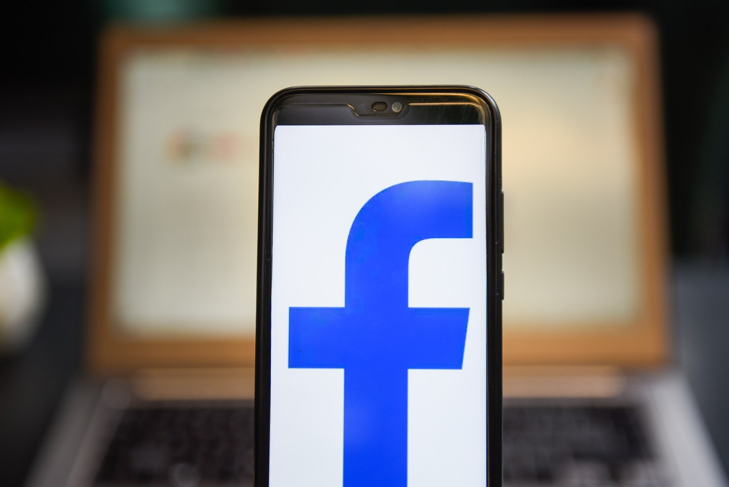 In this photo illustration a Facebook logo seen displayed on a