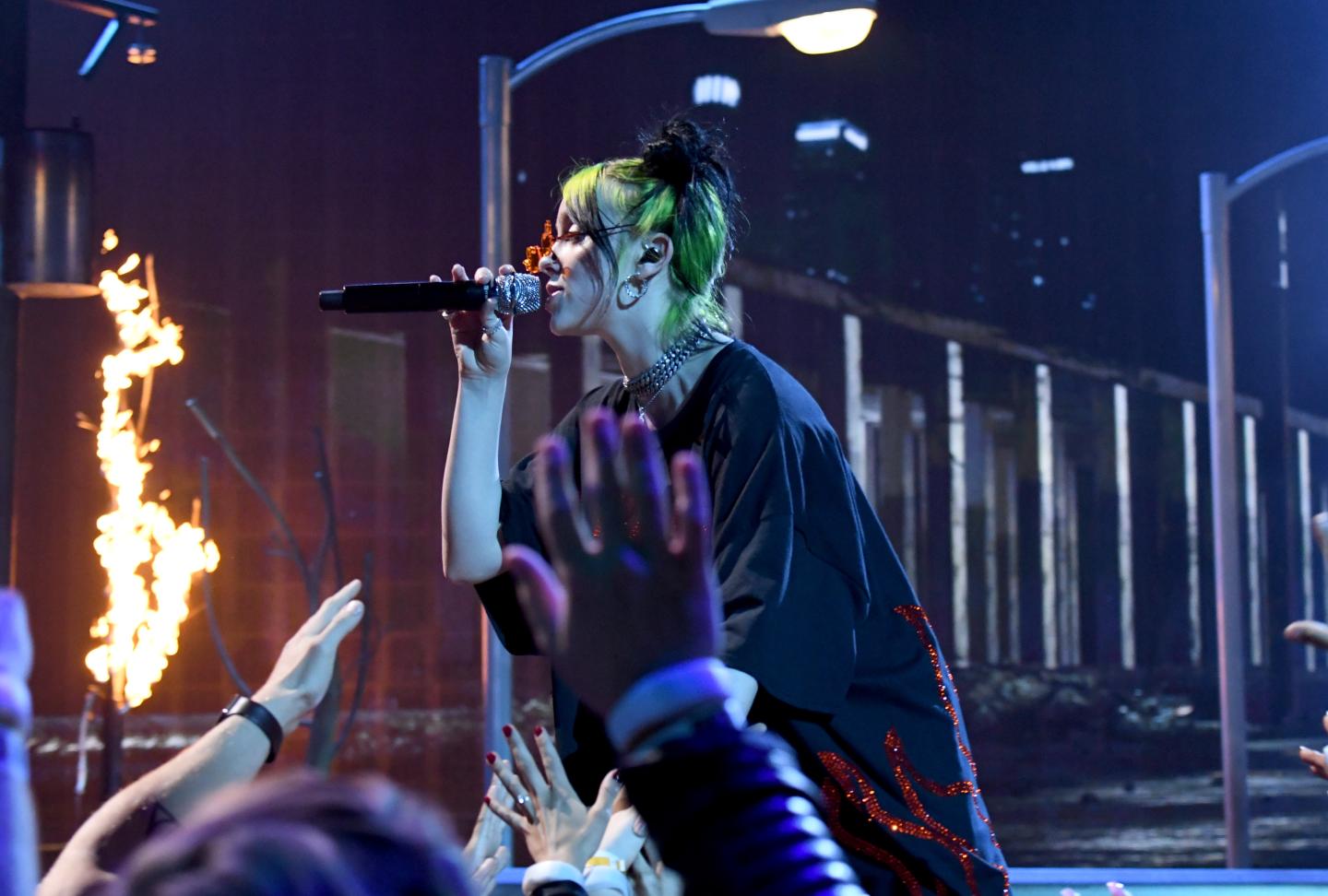 Billie Eilish performs onstage during the 2019 American Music Awards.