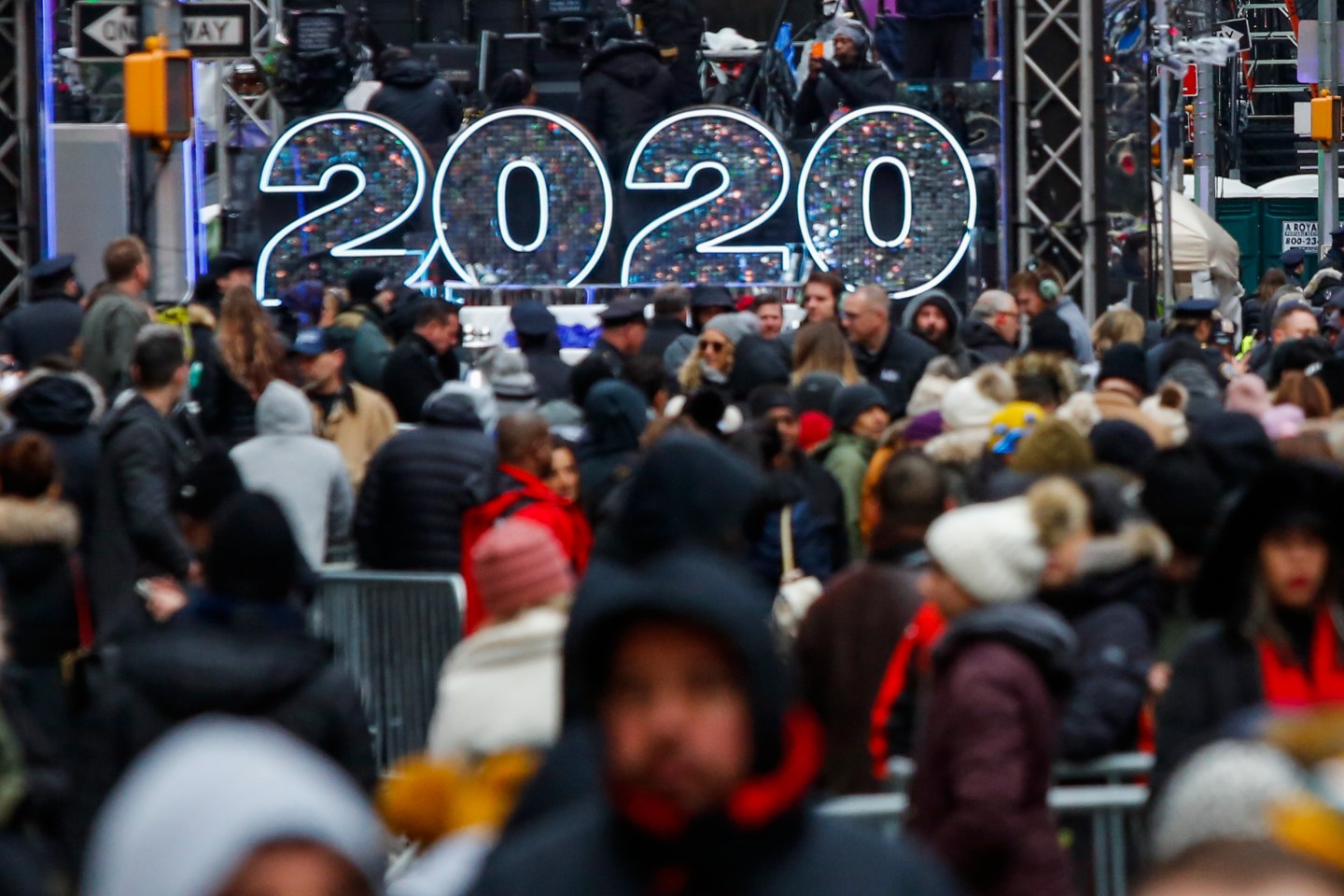 NEW YORK, NY - DECEMBER 31: People wait to celebrate New Years eve in Times Square on December 31, 2019 in New York City. Because of the mild weather, a larger than usual crowd of people visiting from all over the world is expected to watch the ball drop. (Photo by Eduardo Munoz Alvarez/Getty Images)
