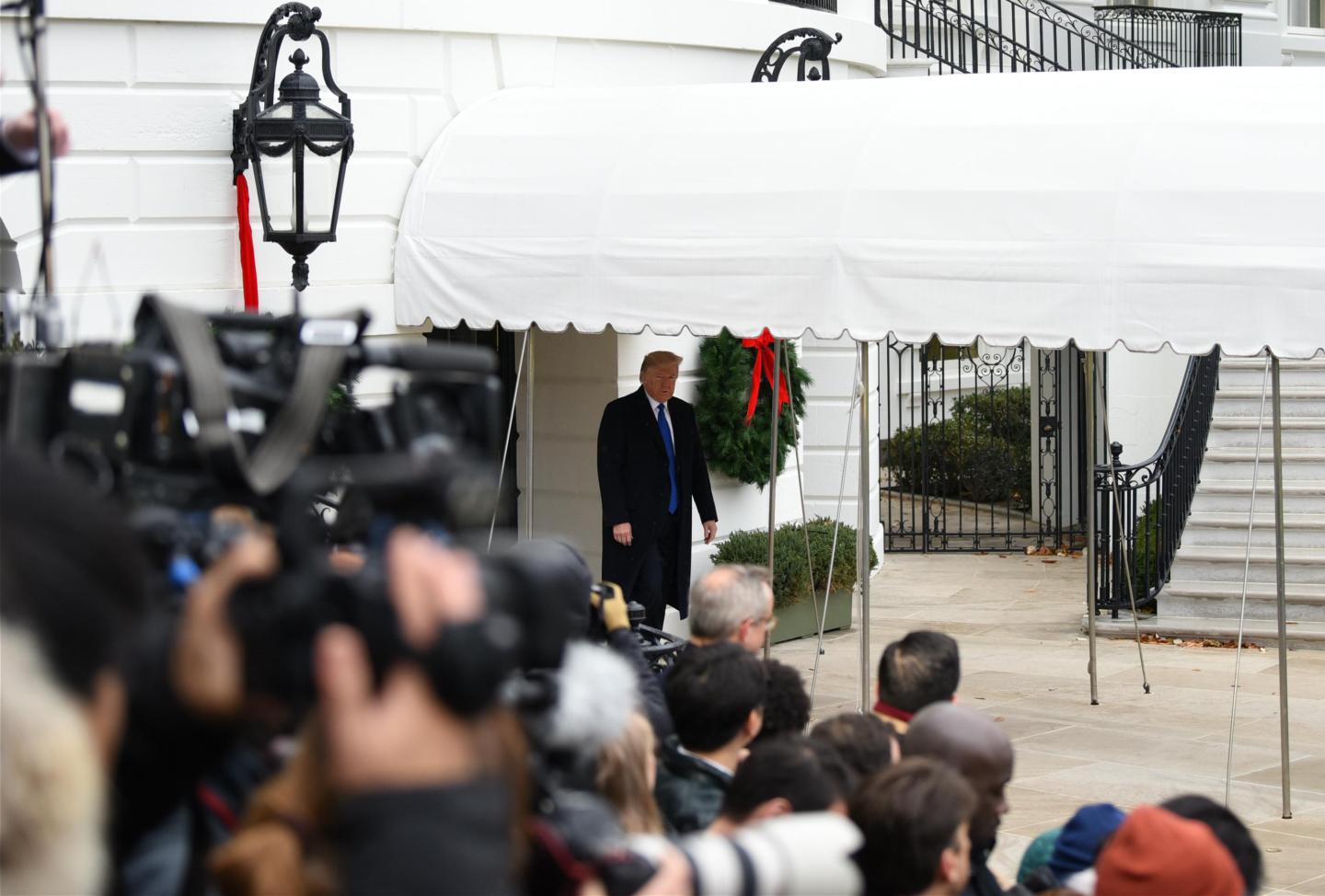 WASHINGTON, DC - DECEMBER 02: U.S. President Donald Trump walks out of the White House to attend NATO Leaders Meeting in London on December 2, 2019 in Washington, DC. (Photo by Chen Mengtong/China News Service/VCG via Getty Images)