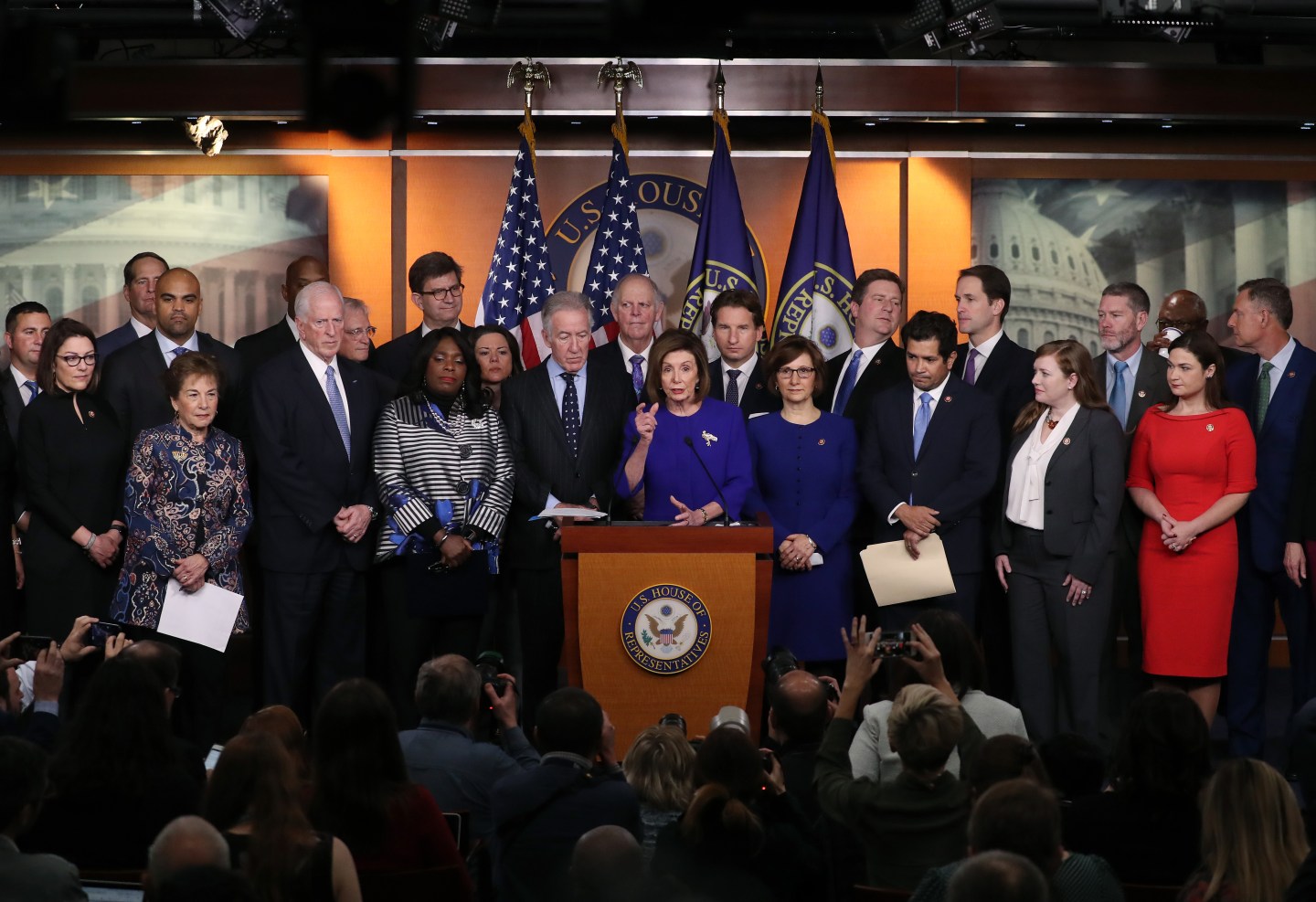 WASHINGTON, DC - DECEMBER 10: U.S. House Speaker Nancy Pelosi (D-CA) speaks while flanked by fellow members during a news conference on the USMCA trade agreement, on Capitol Hill December 10, 2019 in Washington, DC. Pelosi said an agreement has been reached on a deal over the U.S.-Mexico-Canada, but final details for the trade pact were still being ironed out. (Photo by Mark Wilson/Getty Images)