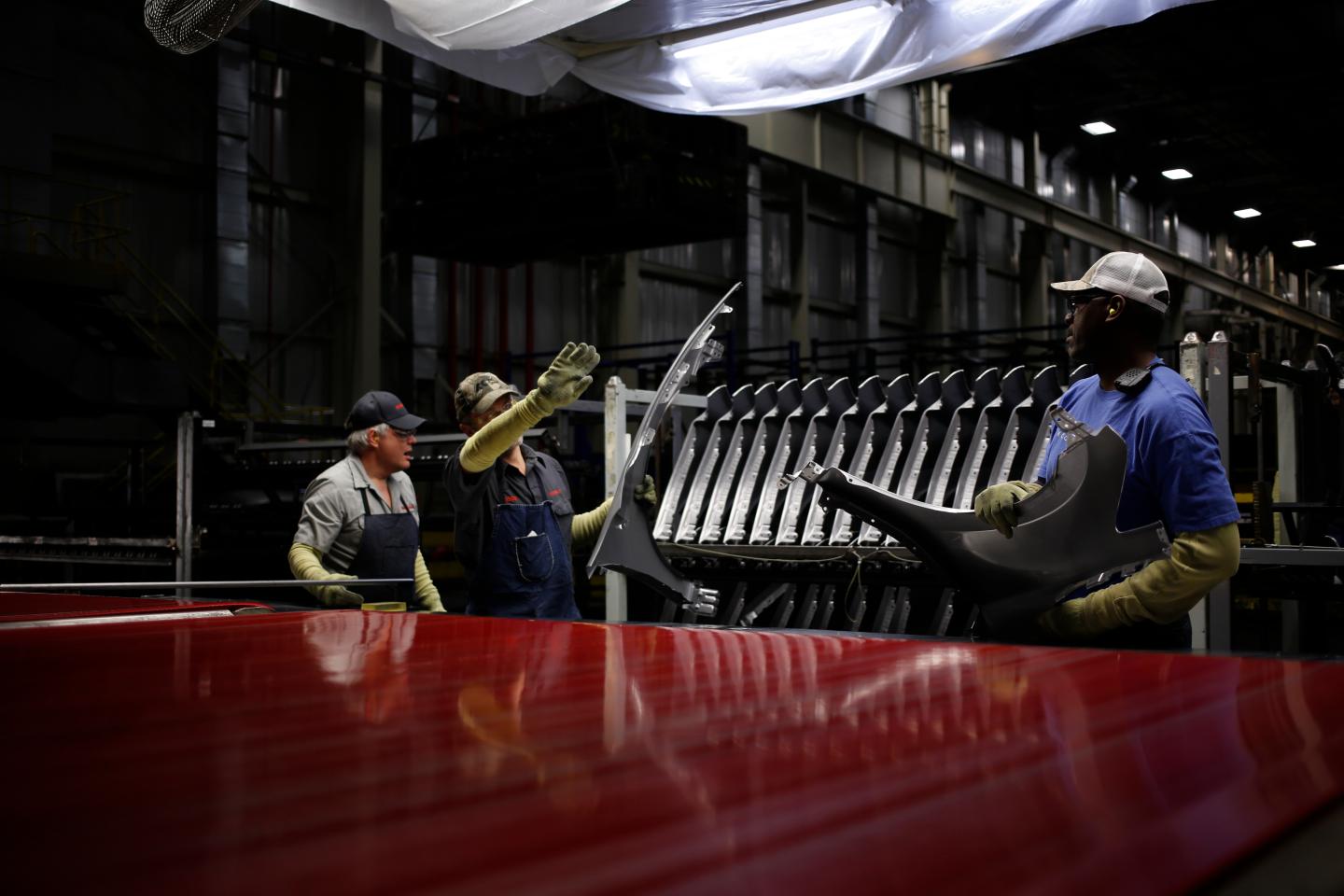 Employees inspect aluminum fenders at the Nissan Motor Co. manufacturing facility in Smyrna, Tennessee.