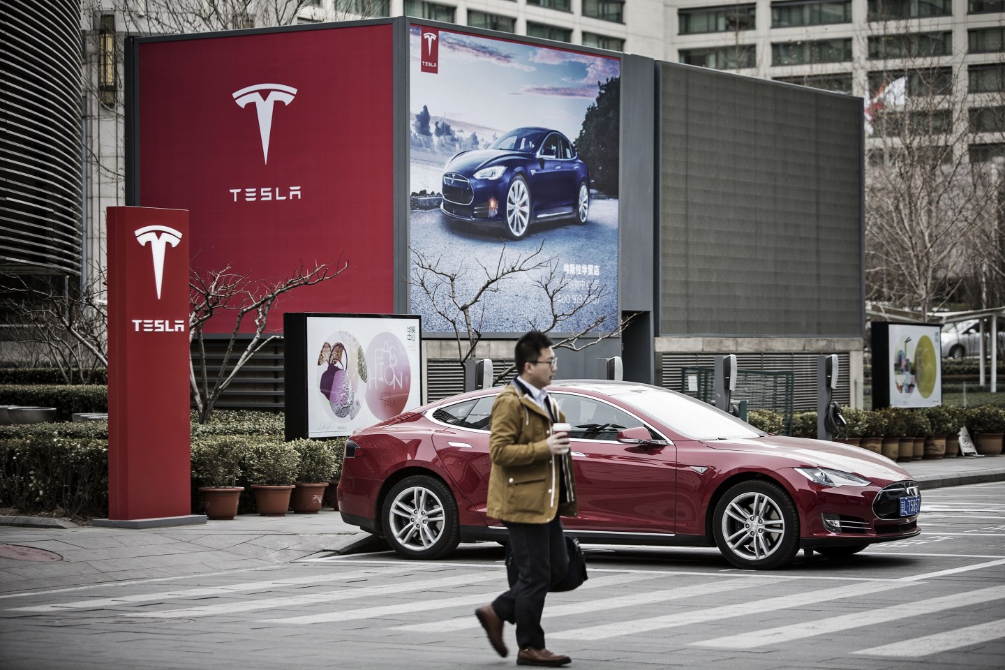 A Tesla Motors Model S electric automobile at one of the company's electric charging stations in Beijing.
