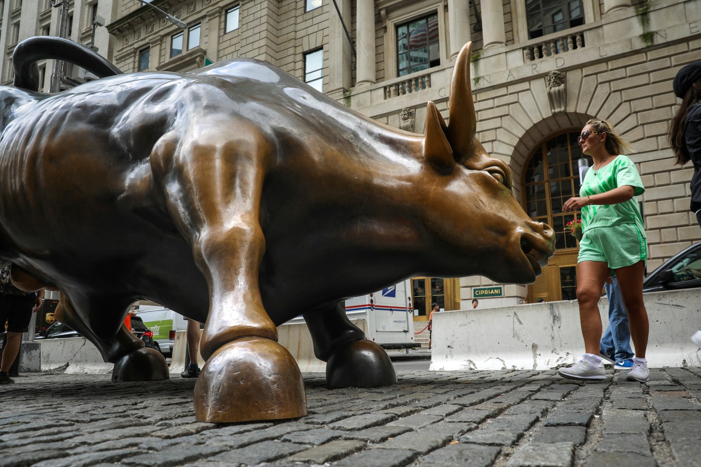 NEW YORK, NY - AUGUST 22: Tourists visit the Wall Street bull statue in the Financial District, August 22, 2018 in New York City. Today marks the longest bull market rally in U.S. history, stretching back to March 2009. The longest previous market rally was from 1990 to March 2000. (Photo by Drew Angerer/Getty Images)