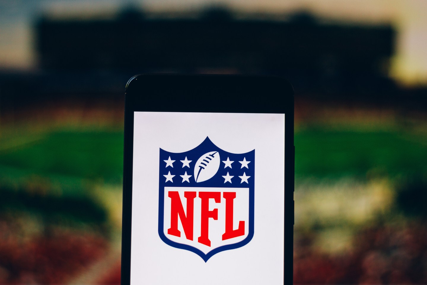A National Football League (NFL) logo displayed on a smartphone. The NFL and more than 12 teams had their Twitter accounts hacked by OurMine, Monday, just days before the Super Bowl. Photo Illustration by Rafael Henrique via Getty Images