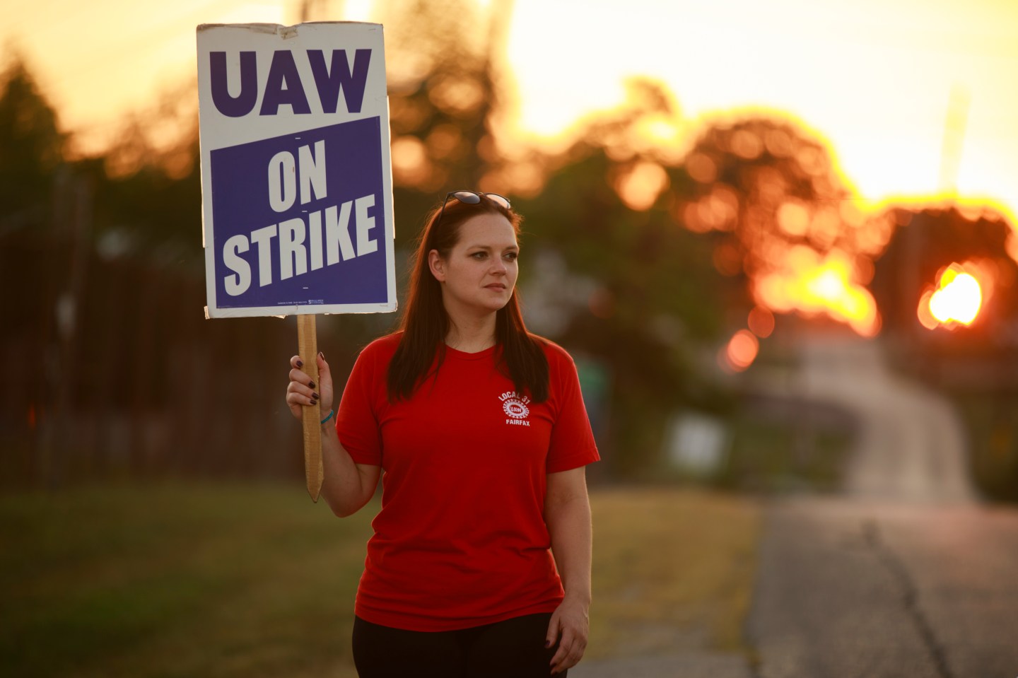 A worker from United Auto Workers Local 440 holds a picket outside the General Motors Bedford Powertrain factory.