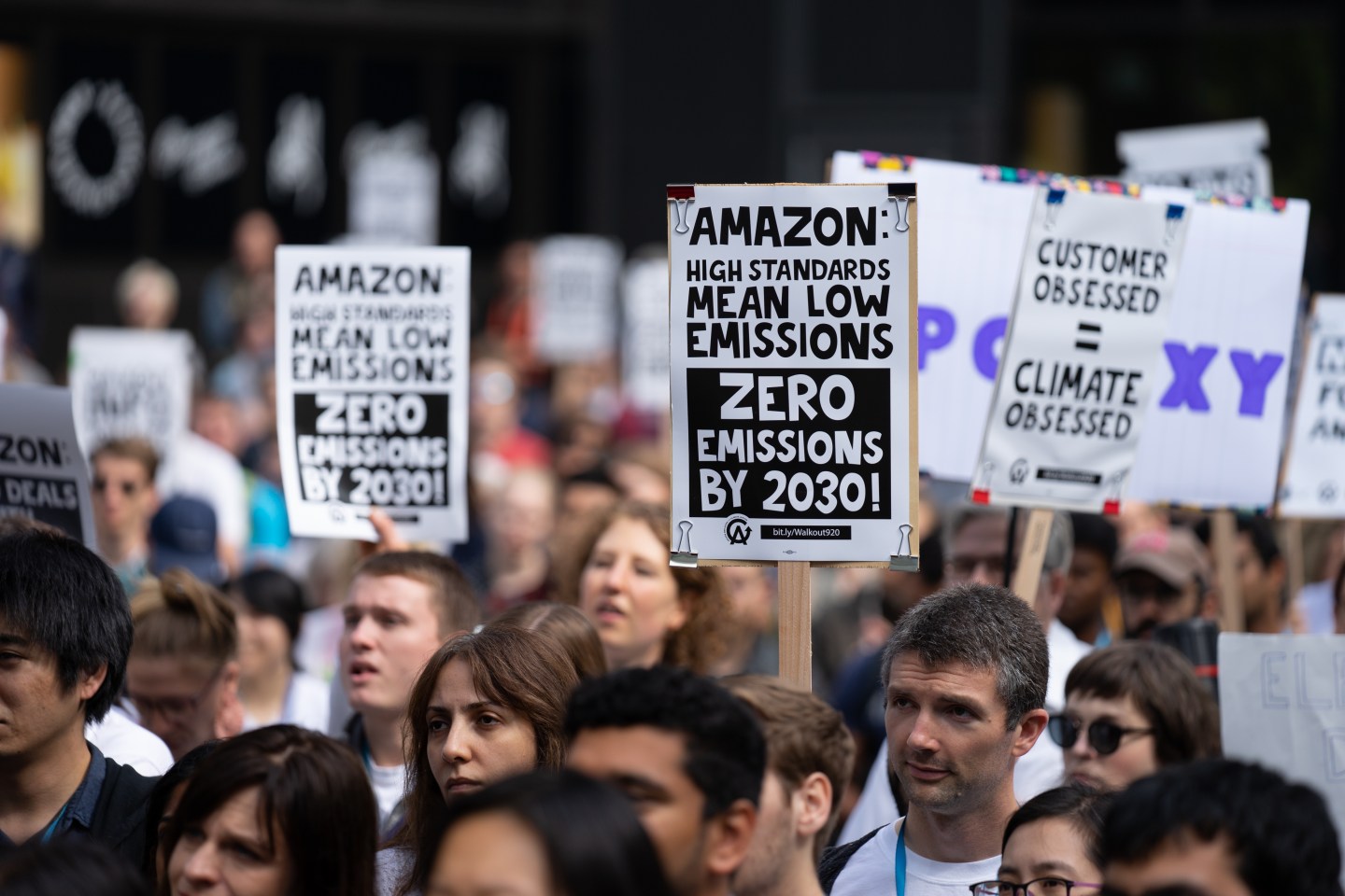 Amazon.com and Google employees hold signs outside Amazon.com's headquarters before the Global Climate Strike in Seattle on Sept. 20, 2019.
