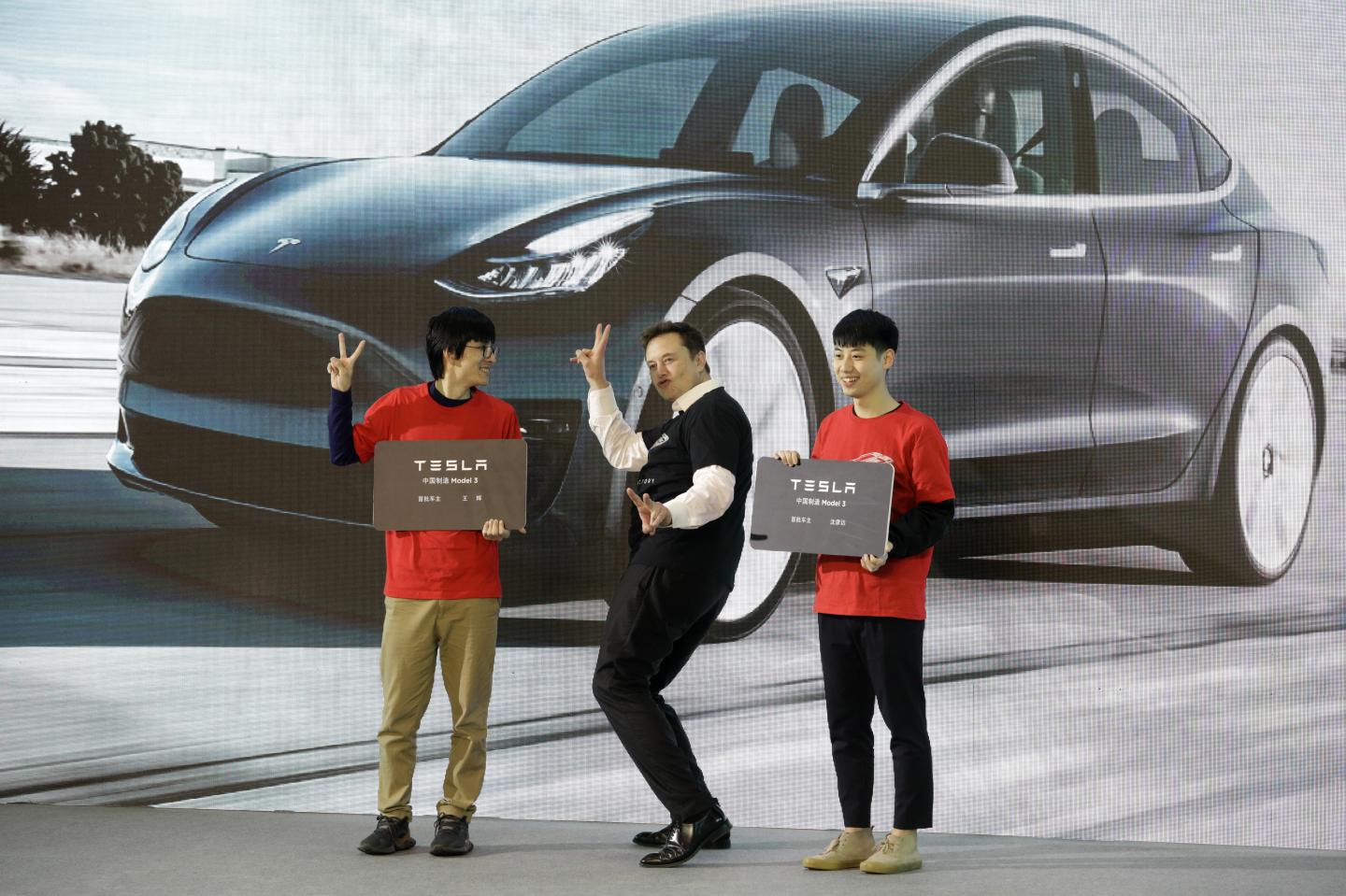 Elon Musk, chief executive officer of Tesla Inc., gestures during the Tesla China-Made Model 3 Delivery Ceremony at the company's Gigafactory in Shanghai, China, on Tuesday, Jan. 7, 2020. Tesla kicked off production in China, marking a major step in Musks global push for electric-vehicle domination and heralding what could be the dawn of real competition in the worlds largest EV market. Photographer: Qilai Shen/Bloomberg via Getty Images