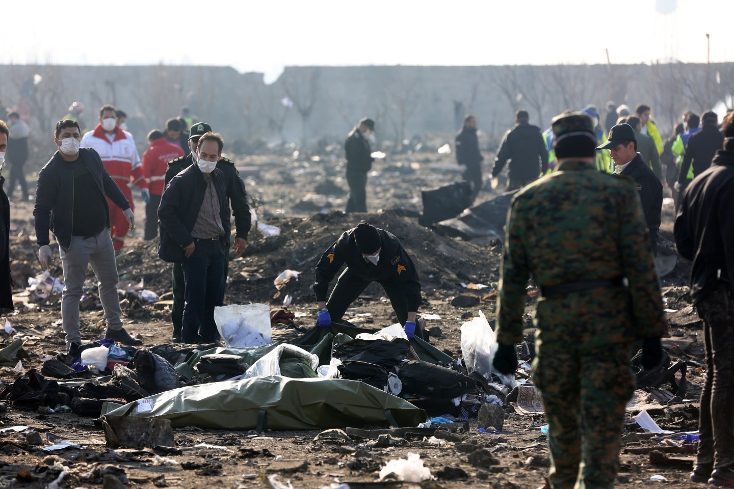 TEHRAN, IRAN - JANUARY 08: Search and rescue works are conducted at site after a Boeing 737 plane belonging to a Ukrainian airline crashed near Imam Khomeini Airport in Iran just after takeoff with 180 passengers on board in Tehran, Iran on January 08, 2020. All 167 passengers and nine crew members on an Ukrainian 737 plane that crashed near Iran's capital Tehran early Wednesday have died, according to a state official. (Photo by Fatemeh Bahrami/Anadolu Agency via Getty Images)