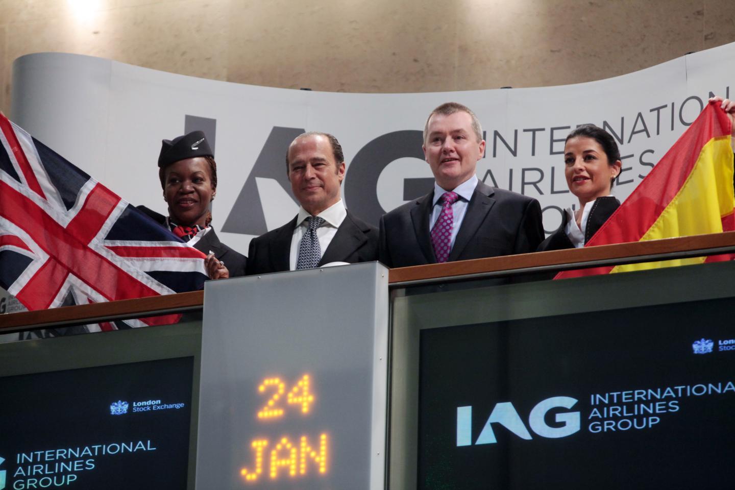 FILE: Antonio Vazquez, chairman of International Consolidated Airlines Group SA (IAG), center left, and Willie Walsh, chief executive officer of International Consolidated Airlines Group SA, center right, pose alongside airline staff at the London Stock Exchange, in London. U.K., on Monday, Jan. 24, 2011. IAG SA Chief Executive Officer Walsh is to retire after 15 years in charge of the airline group and predecessor British Airways, to be replaced by Luis Gallego, currently head of the groups Spanish Iberia arm. Walsh, 58, will stand down from the CEO role and the IAG board on March 26 and formally retire at the end of June, IAG said in a statement Thursday. Photographer: Jason Alden/Bloomberg via Getty Images