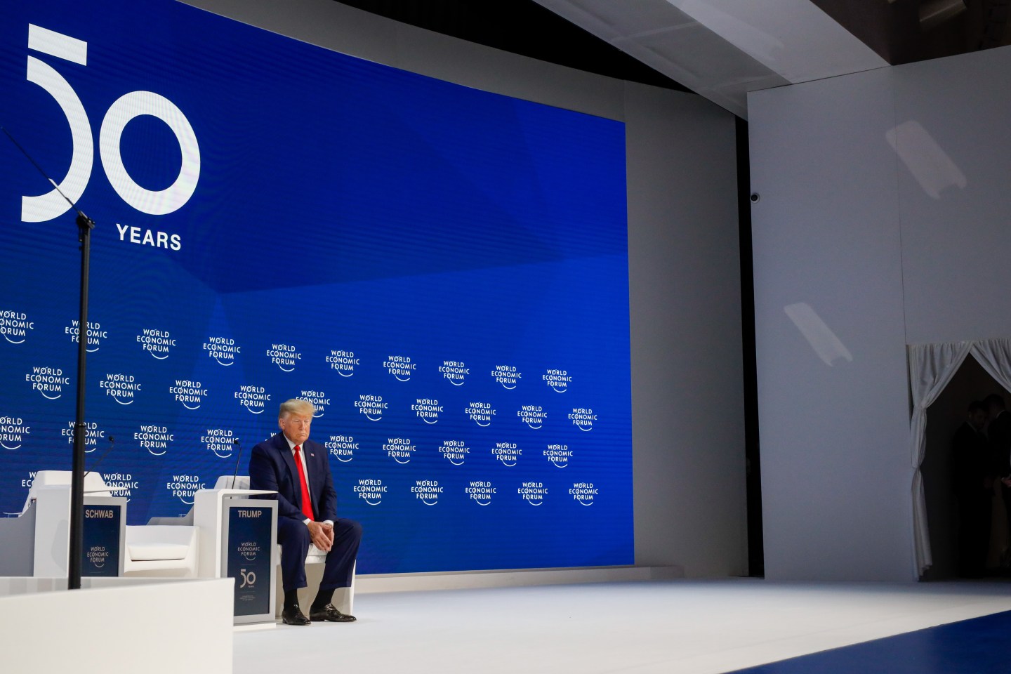 U.S. President Donald Trump waits to delivers a speech during a special address on the opening day of the World Economic Forum (WEF) in Davos, Switzerland, on Tuesday, Jan. 21, 2020. World leaders, influential executives, bankers and policy makers attend the 50th annual meeting of the World Economic Forum in Davos from Jan. 21 - 24. Photographer: Jason Alden/Bloomberg via Getty Images