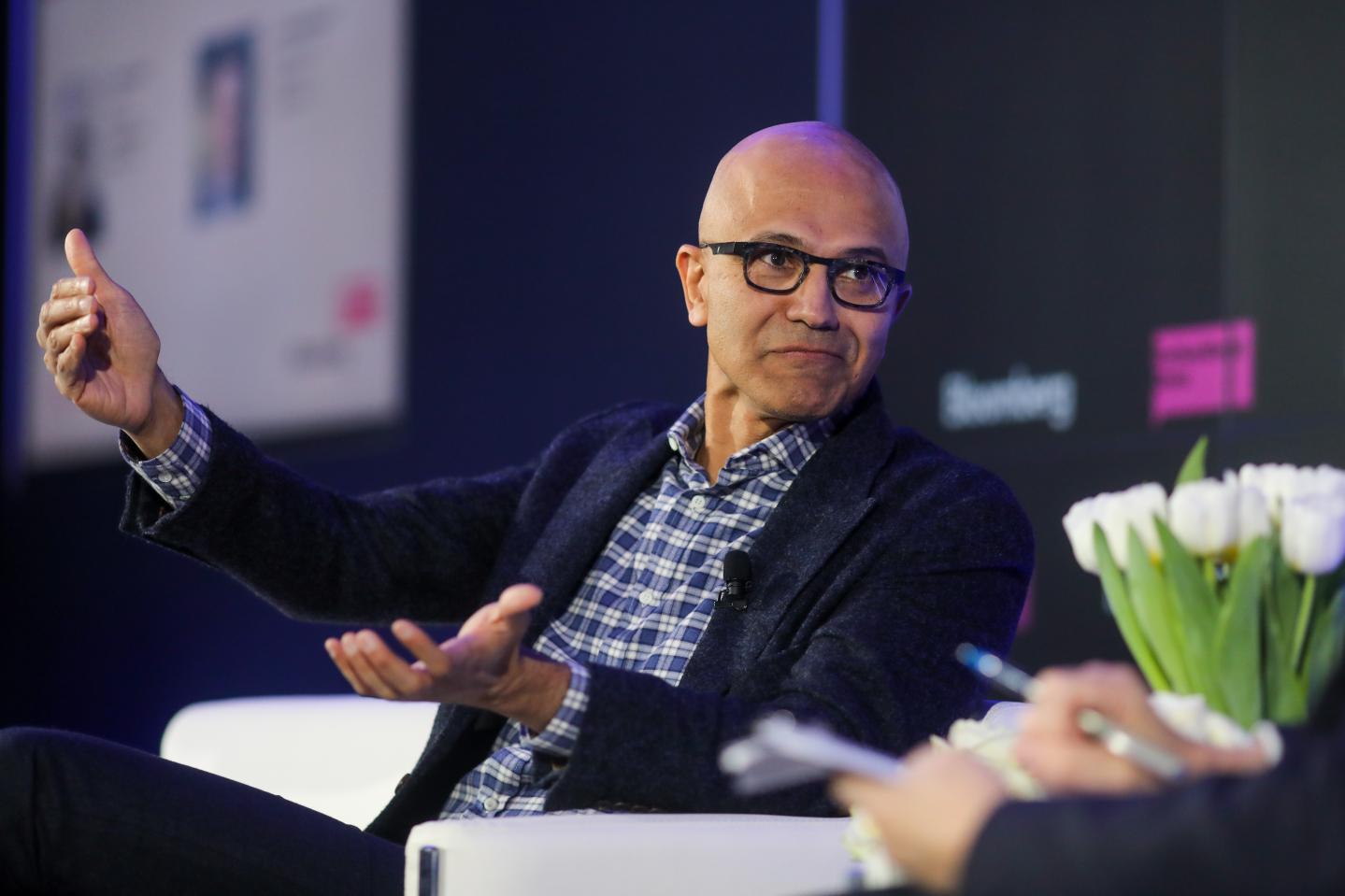 Satya Nadella, chief executive officer of Microsoft Corp., gestures as he speaks during a Bloomberg event on the opening day of the World Economic Forum (WEF) in Davos, Switzerland, on Tuesday, Jan. 21, 2020.