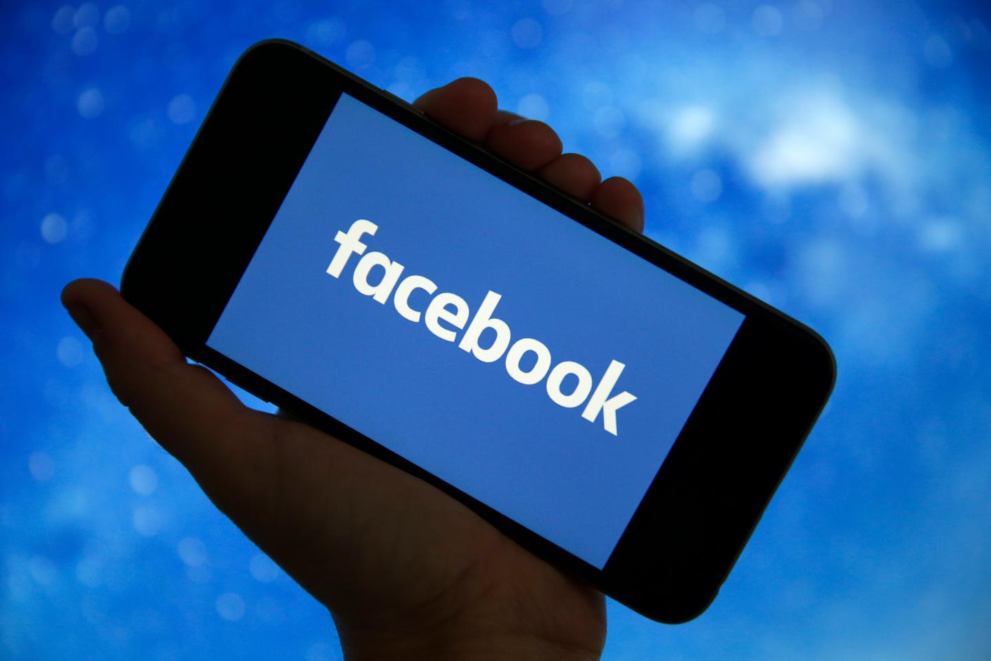 Facebook's logo is displayed on the screen of an iPhone on December 26, 2019 in Paris, France. The American company Facebook created in 2004 by Mark Zuckerberg builds technologies that give people the power to connect with friends and family, find communities and grow businesses.