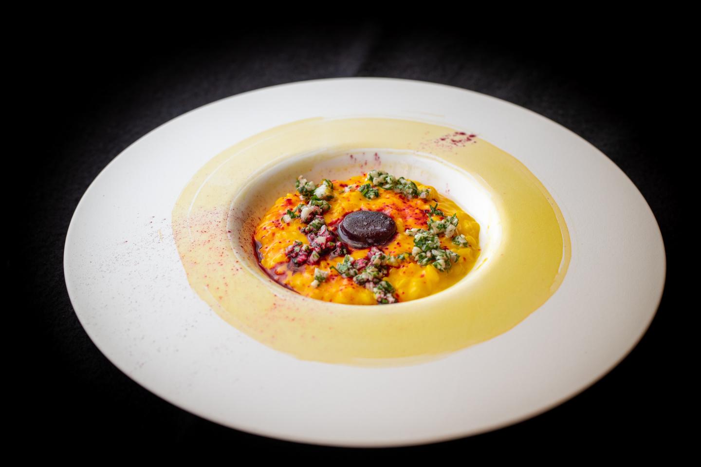 Pretty as a painting, the saffron risotto is served with eel gremolata and beetroot sorbet at the Royal Mansour's new Sesamo restaurant.