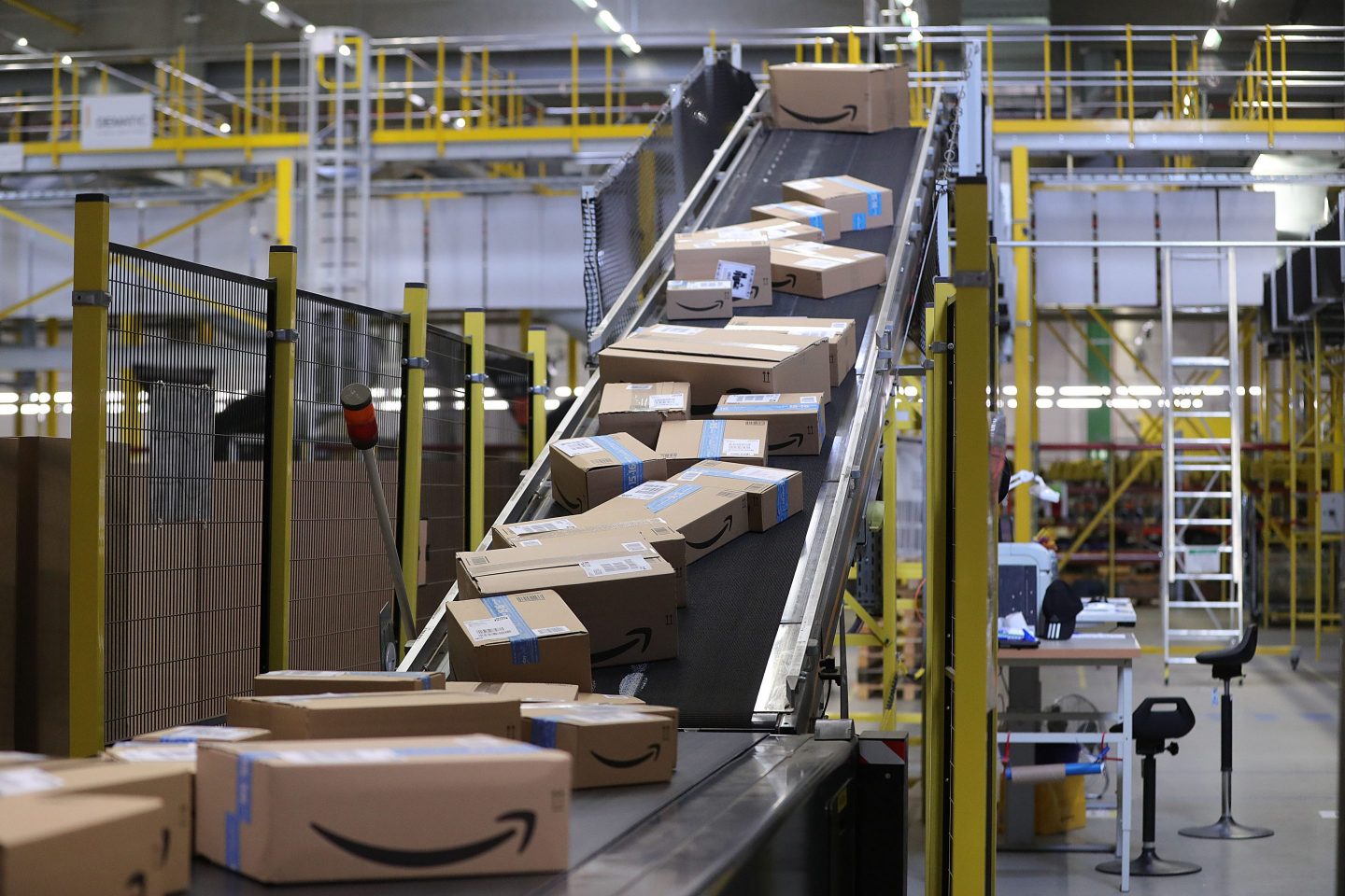 Sealed boxes move along a conveyor into a truck dock ahead of shipping from an Amazon.com Inc. fulfilment center during the online retailer's Prime Day sales promotion day in Koblenz, Germany, on Monday, July 15, 2019.