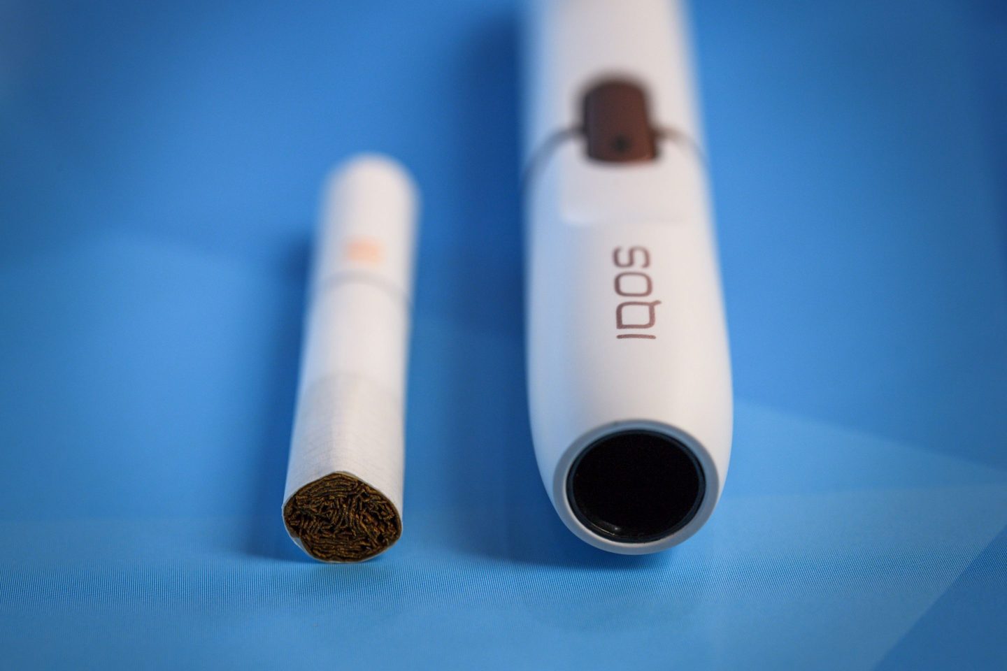 A picture taken on August 21, 2018 in Neuchatel, at the research and development campus of cigarette and tobacco manufacturing company Philip Morris International shows an iQOS electronic cigarette, which heats tobacco sticks but does not burn them.