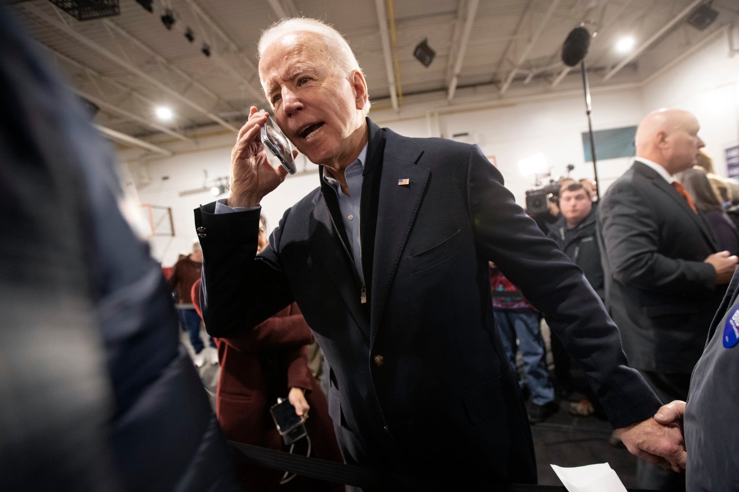 Democratic presidential candidate former Vice President Joe Biden wishes Barbara Moroney, of Rocky Point, N.Y., a happy 80th birthday on the phone during a campaign rally, Tuesday, Feb. 4, 2020, in Nashua, N.H. (AP Photo/Mary Altaffer)