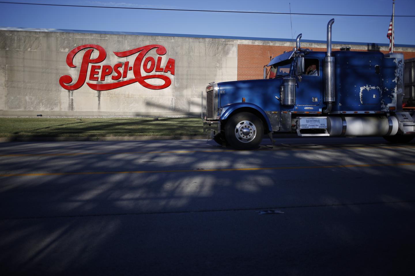 A truck passes in front of a PepsiCo Inc. facility in Louisville, Kentucky, U.S., on Tuesday, Sept. 24, 2019. PepsiCo Inc. is scheduled to release earnings figures on October 3. Photographer: Luke Sharrett/Bloomberg via Getty Images
