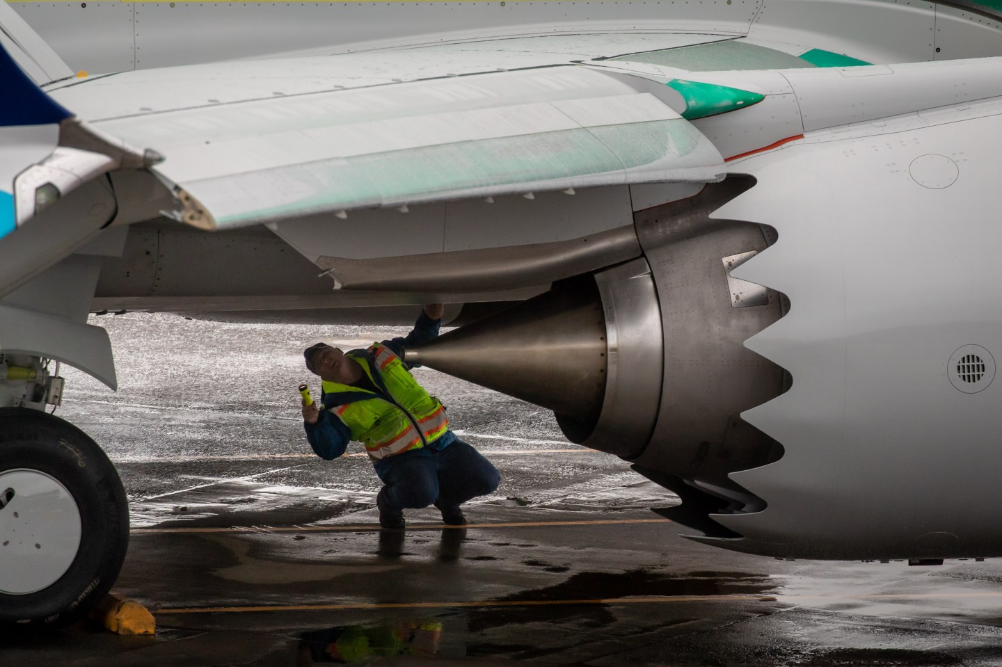 A worker inspects a Boeing 737 Max aircraft.