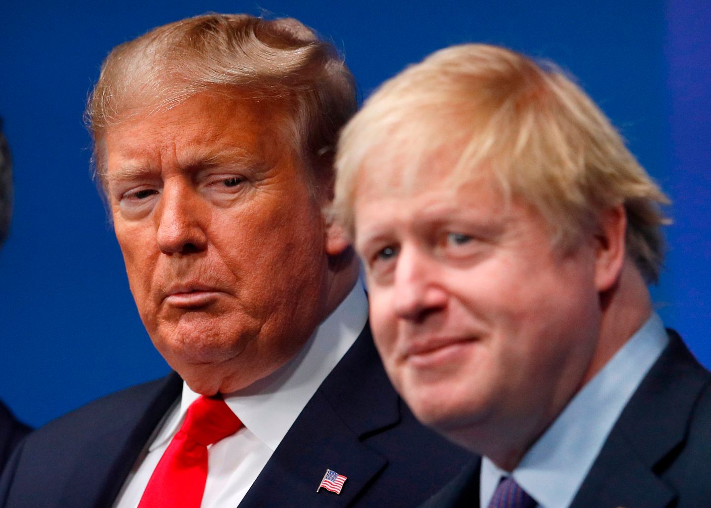 TOPSHOT - Britain's Prime Minister Boris Johnson (R) welcomes US President Donald Trump (L) to the NATO summit at the Grove hotel in Watford, northeast of London on December 4, 2019. (Photo by PETER NICHOLLS / various sources / AFP) (Photo by PETER NICHOLLS/AFP via Getty Images)