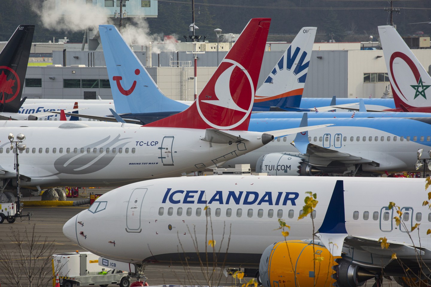 Grounded Boeing Co. 737 Max airplanes are seen in a parking lot near Boeing Field in Seattle, Washington, U.S., on Tuesday, Dec. 17, 2019. Boeing plans to halt production of its grounded 737 Max in January, a move that will deepen the crisis engulfing the planemaker, complicate its eventual recovery and ripple through the U.S. economy. Photographer: David Ryder/Bloomberg via Getty Images