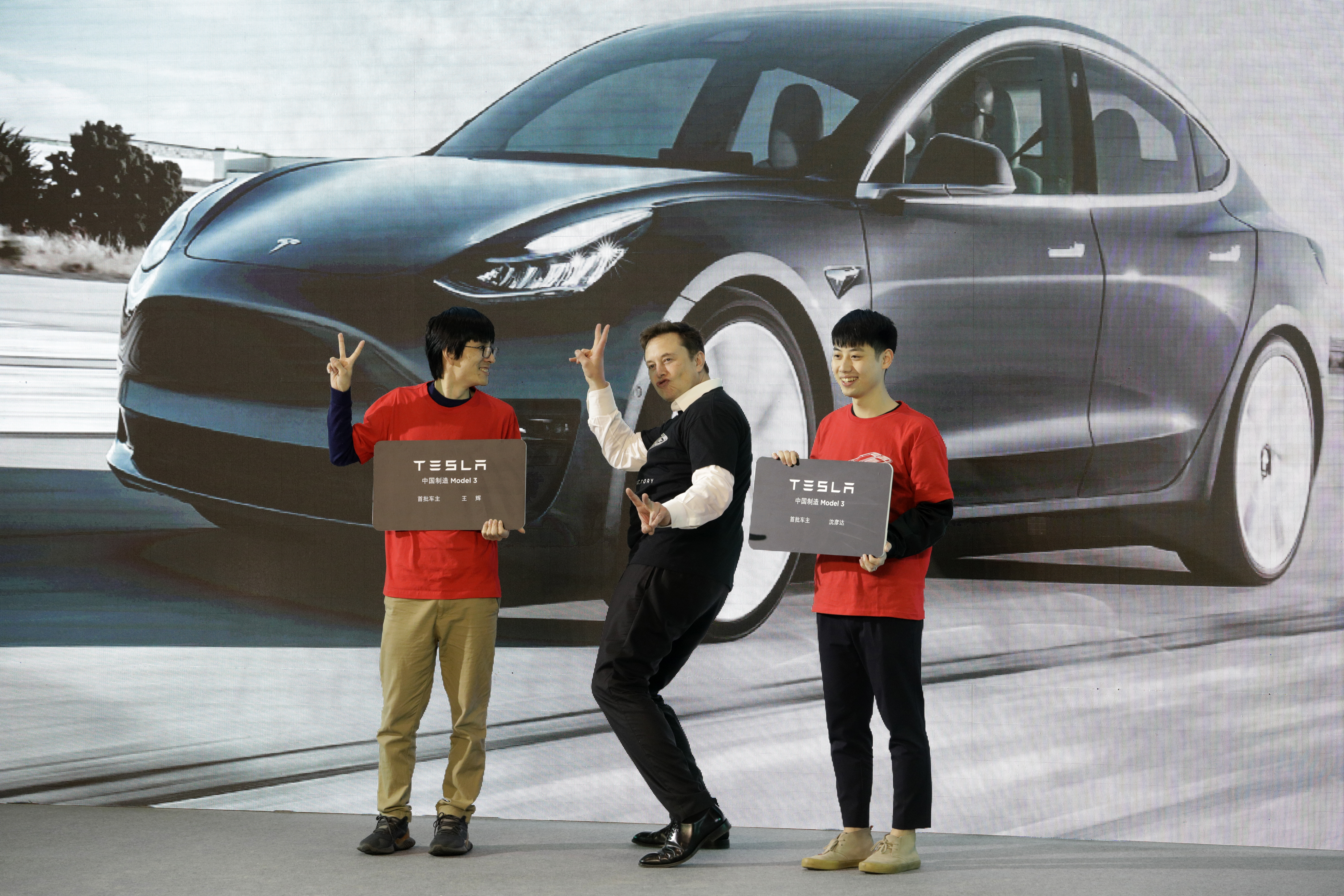 Elon Musk, chief executive officer of Tesla Inc., gestures during the Tesla China-Made Model 3 Delivery Ceremony at the company's Gigafactory in Shanghai, China, on Tuesday, Jan. 7, 2020. Tesla shares have skyrocketed roughly 100% so far in 2020. Wire photography: Qilai Shen—Bloomberg via Getty Images