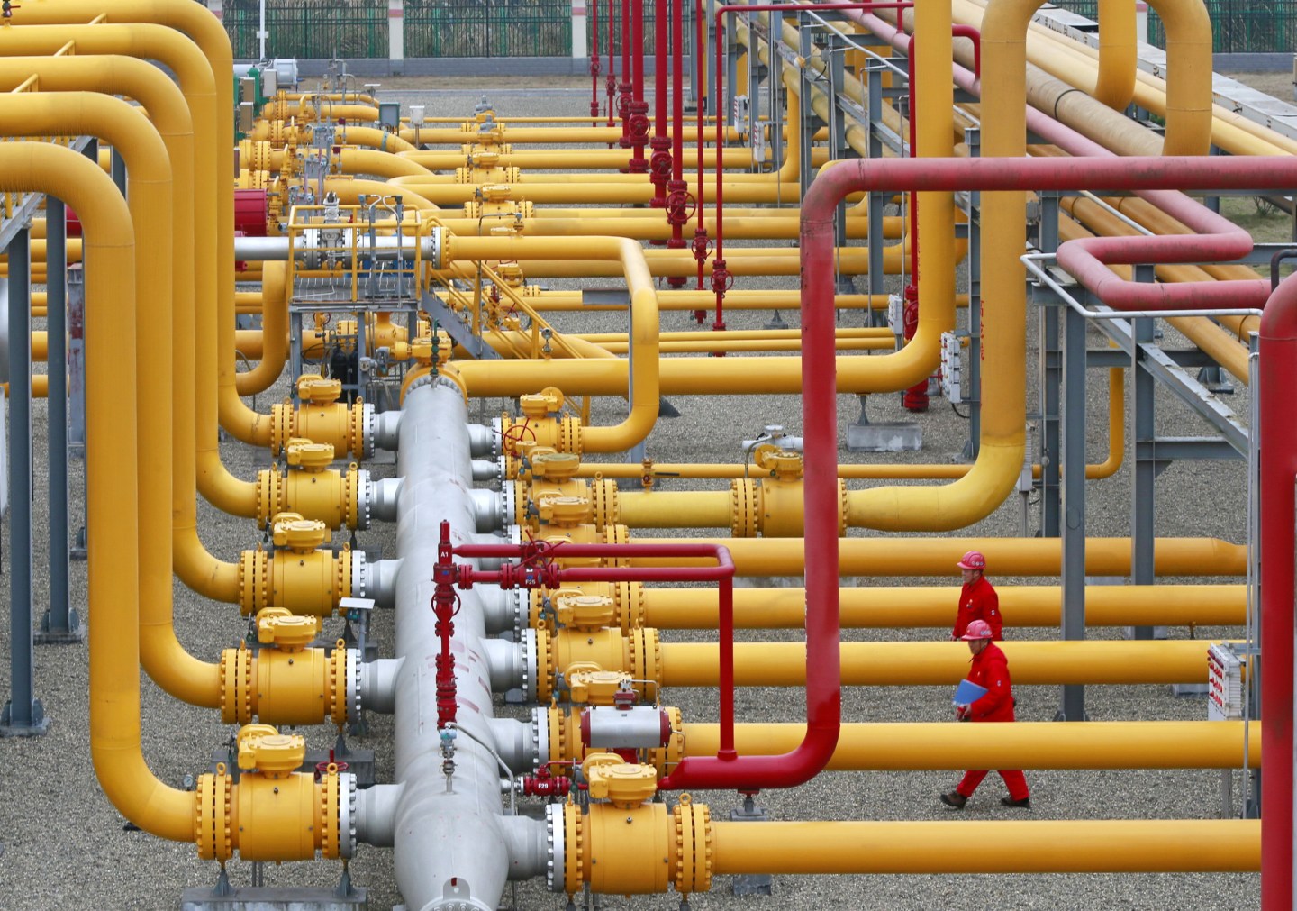 the virus has upended trade flows and probably led to a 20% cut to China’s oil demand. Here, staff on PetroChina Southwest Oil & Gasfield Company, a CNPC subsidiary, work at the natural gas purification plant in Suining in southwest China's Sichuan province on Jan. 15, 2020.