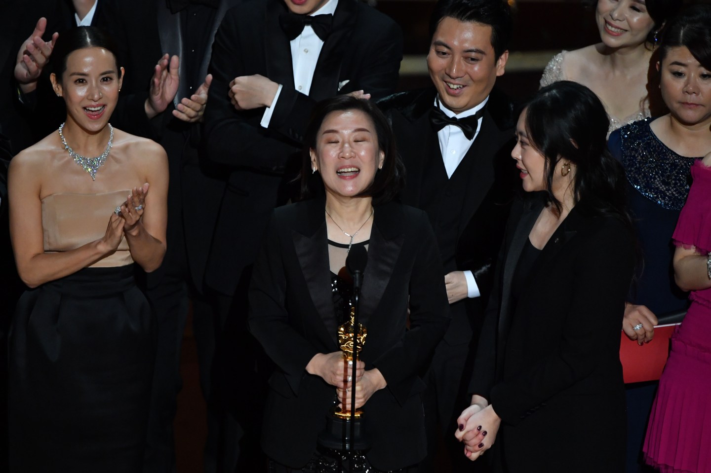 "Parasite" producer Kwak Sin-ae (C) accepts the award for Best Picture for "Parasite" during the 92nd Oscars at the Dolby Theatre in Hollywood, California on February 9, 2020.