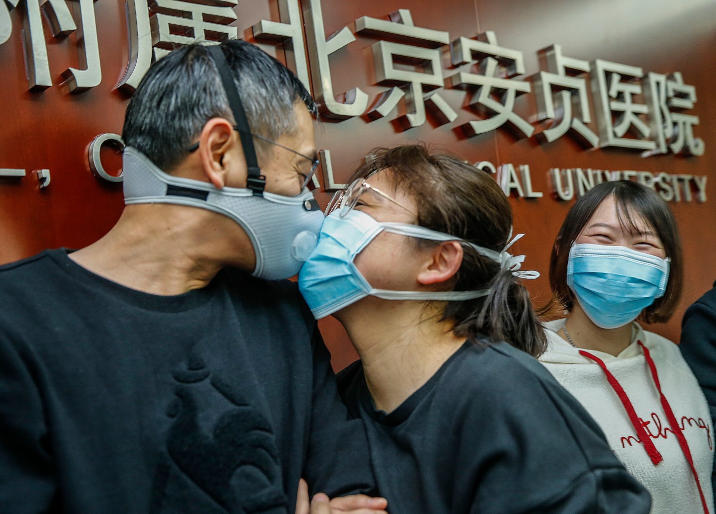 BEIJING -- Cao Liyao C, a female health worker on a team of 136 Beijing medical workers, kisses goodbye to her husband Wang Bin before leaving for Wuhan of Hubei Province to join the fight against the novel coronavirus epidemic, in Beijing, capital of China, Jan. 27, 2020. (Photo by Zhang Yuwei/Xinhua via Getty) (Xinhua/Zhang Yuwei via Getty Images)