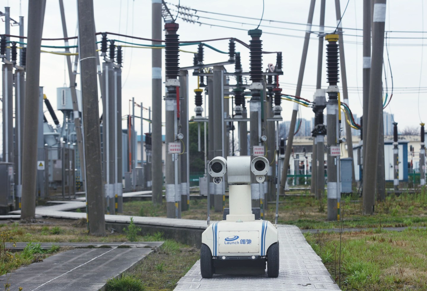 A robot armed with optical and infrared cameras inspects the lines and connectors in a transforming station to ensure power supply to hospitals in Hangzhou in east China's Zhejiang province Wednesday, Feb. 19, 2020.