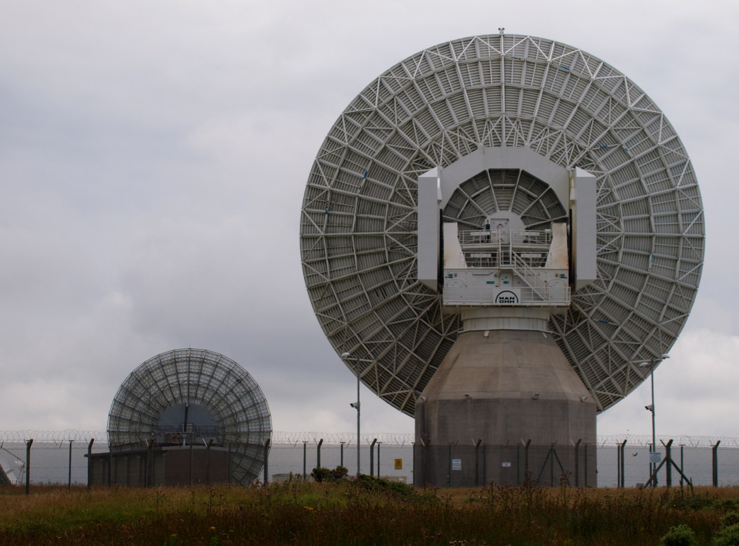 The back of two satellite antenna at the Bude, Cornwall facilities of U.K. spy agency GCHQ.