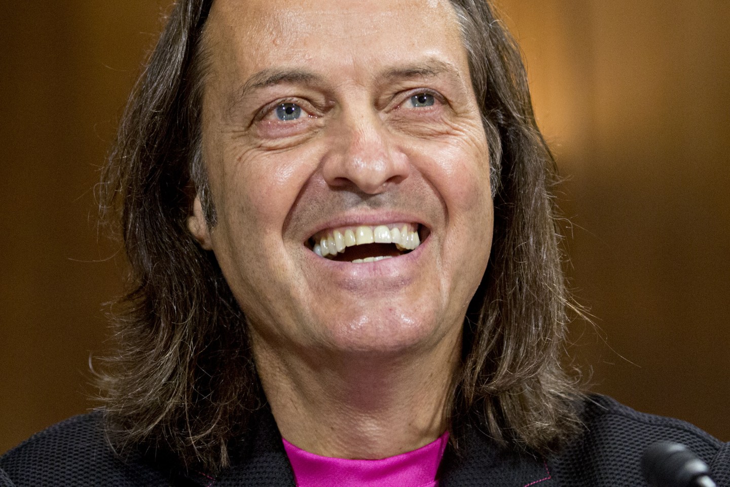 John Legere, chief executive officer of T-Mobile US Inc., smiles during a Senate Judiciary Subcommittee hearing on the impact of the T-Mobile and Sprint transaction in Washington, D.C., U.S., on Wednesday, June 27, 2018.