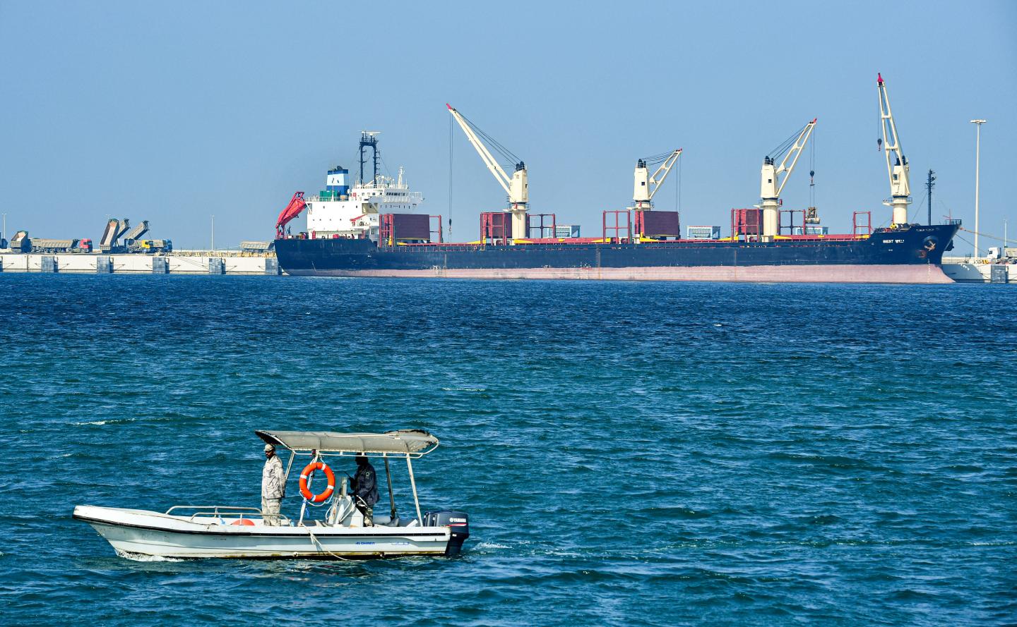 This picture taken on December 11, 2019, shows a Saudi security boat patrolling by an oil tanker at the port of Ras al-Khair, about 185 kilometres north of Dammam in Saudi Arabia's eastern province overlooking the Gulf. (Photo by GIUSEPPE CACACE / AFP) (Photo by GIUSEPPE CACACE/AFP via Getty Images)