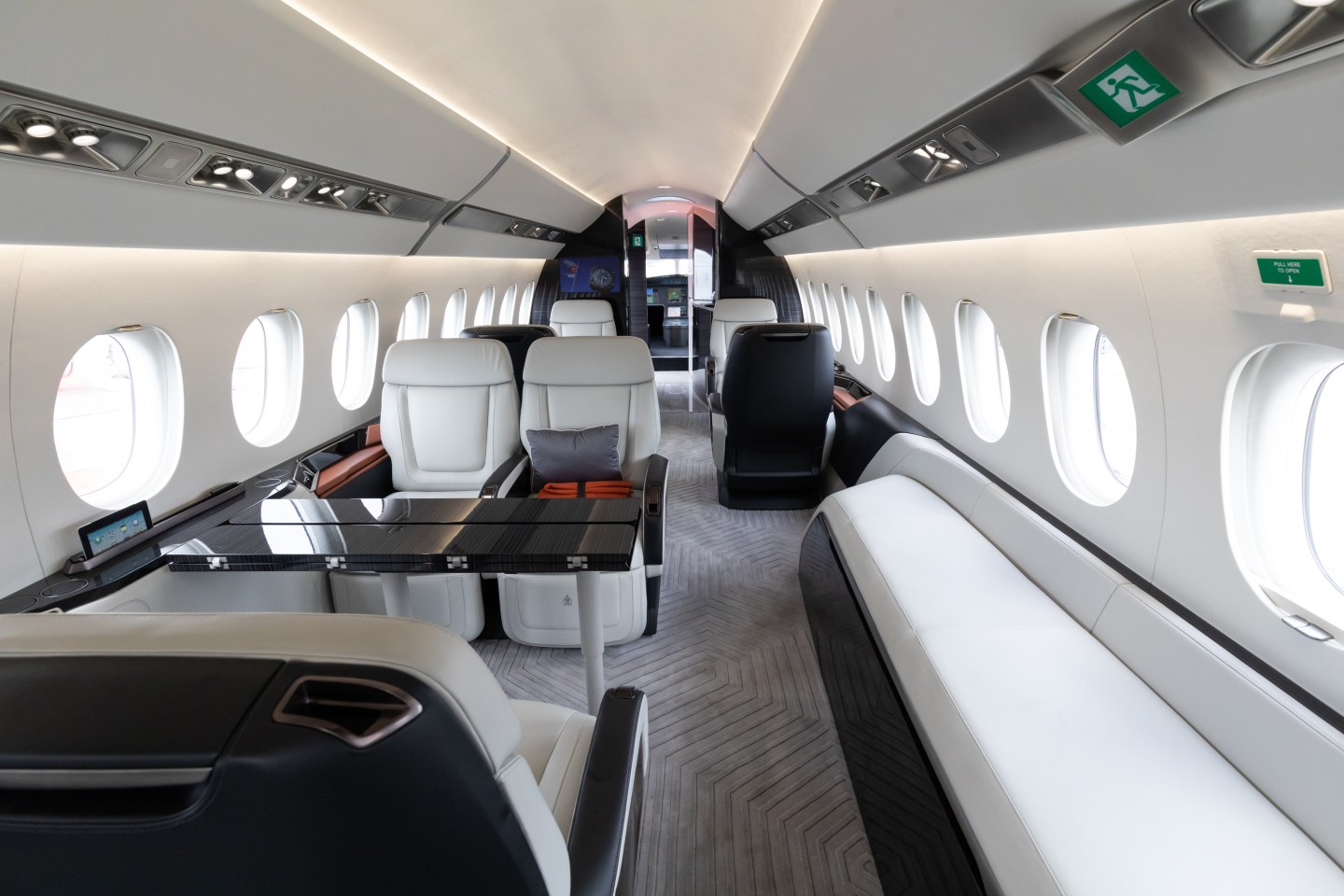 The interior of a mock-up Dassault Aviation SA Falcon 6X private jet is seen during the Singapore Airshow at the Changi Exhibition Centre in Singapore, on Tuesday, Feb. 11, 2020. Planemakers and airlines are exploring new designs to reduce fuel burn and cut carbon emissions in a warming climate. Blending the wings with the fuselage to cut drag is one of several possible solutions. Photographer: SeongJoon Cho/Bloomberg via Getty Images