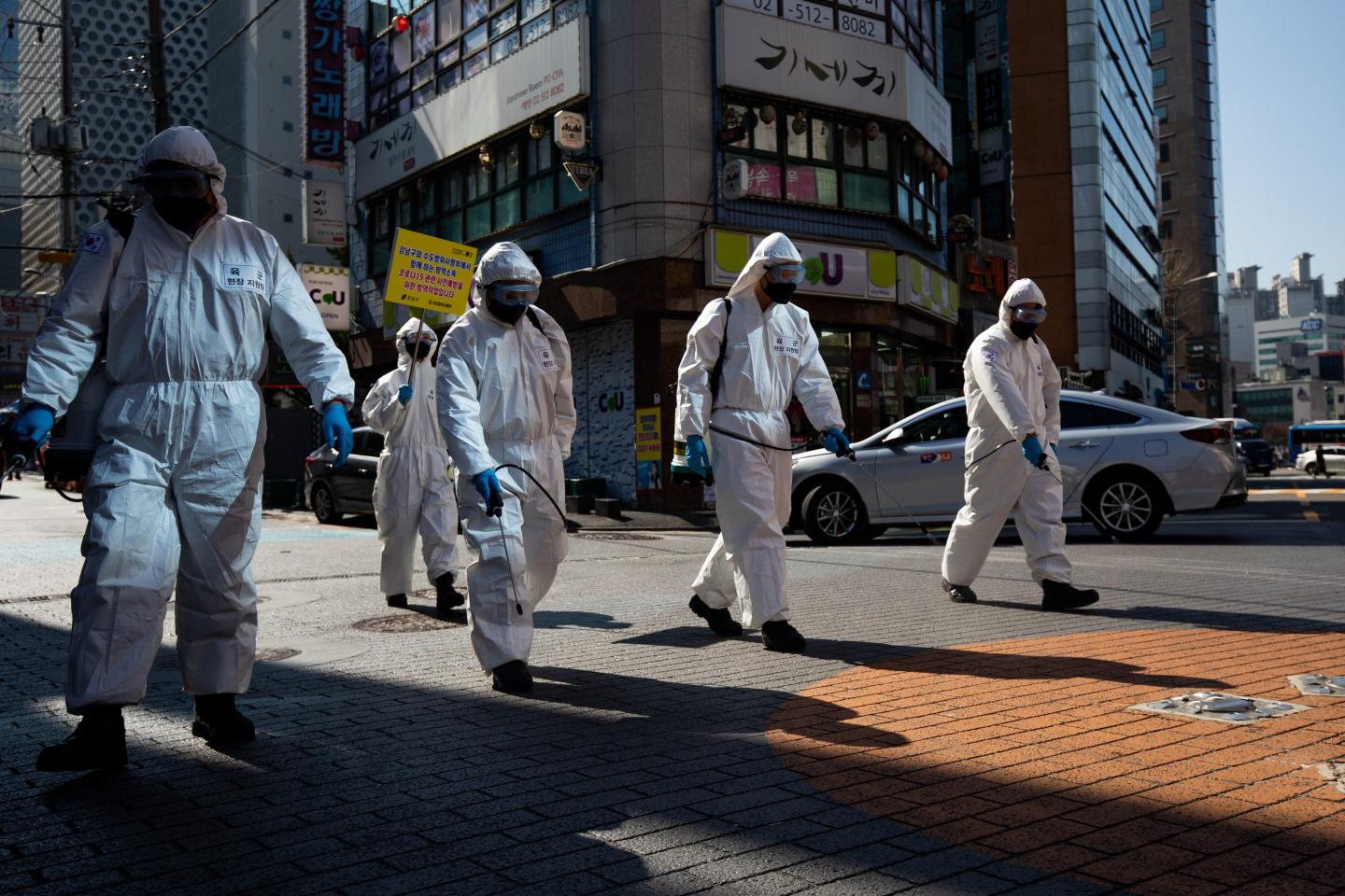South Korean soldiers disinfect an area for covid-19