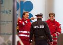 Red Cross medics check the temperature of a policeman during the 178th meeting of the Organization of Petroleum Exporting Countries (OPEC) in Vienna, Austria, on March 6, 2020. - All eyes are on Russia at the gathering of OPEC countries and their allies, with the cartel hoping to convince Moscow to back drastic production cuts to counter the effects of the coronavirus outbreak. (Photo by ALEX HALADA / AFP) (Photo by ALEX HALADA/AFP via Getty Images)
