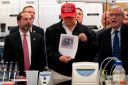 Trump visits CDC as coronavirus spreads in U.S.