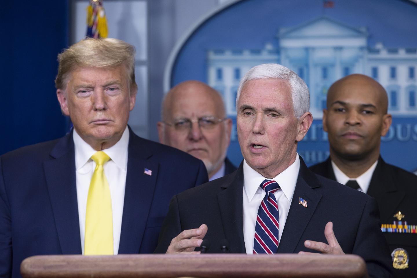 U.S. President Donald Trump listens as Vice President Mike Pence speaks during a news conference in Washington, D.C., on March 9, 2020. Trump said Monday he will seek a payroll tax cut and "very substantial relief" for industries that have been hit by the virus.