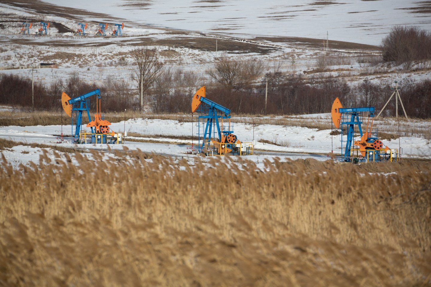 Oil pumping jacks, also known as "nodding donkeys", operate in an oilfield near Almetyevsk, Tatarstan, Russia, on Wednesday, March 11, 2020. Saudi Aramco plans to boost its oil-output capacity for the first time in a decade as the worlds biggest exporter raises the stakes in a price and supply war with Russia and U.S. shale producers. Photographer: Andrey Rudakov/Bloomberg via Getty Images