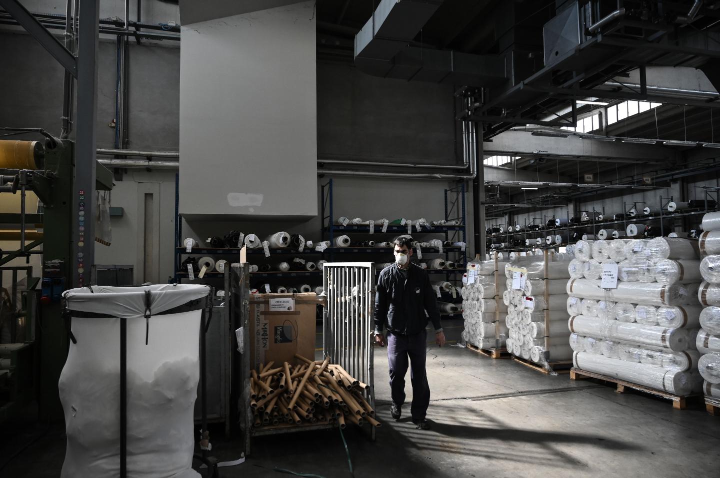 Masks and hand sanitizer replace iPhones and perfume: Firms redeploy factories to make coronavirus supplies