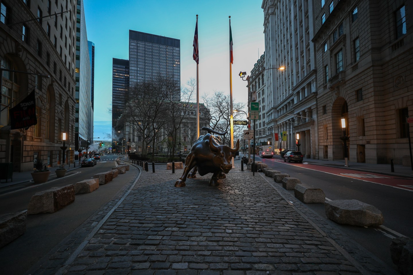 NEW YORK, USA - MARCH 22: Famous Charging Bull Statue is seen lonely at the Financial District in New York, United States on March 22, 2020. The "New York State on PAUSE" that executive order is in effect at 8 p.m. Sunday night, March 22nd. All citizens are required to stay home except to buy their needs as medical or necessary supplies. New York has reached to 17,000 Covid19 cases as of today. (Photo by Tayfun Coskun/Anadolu Agency via Getty Images)